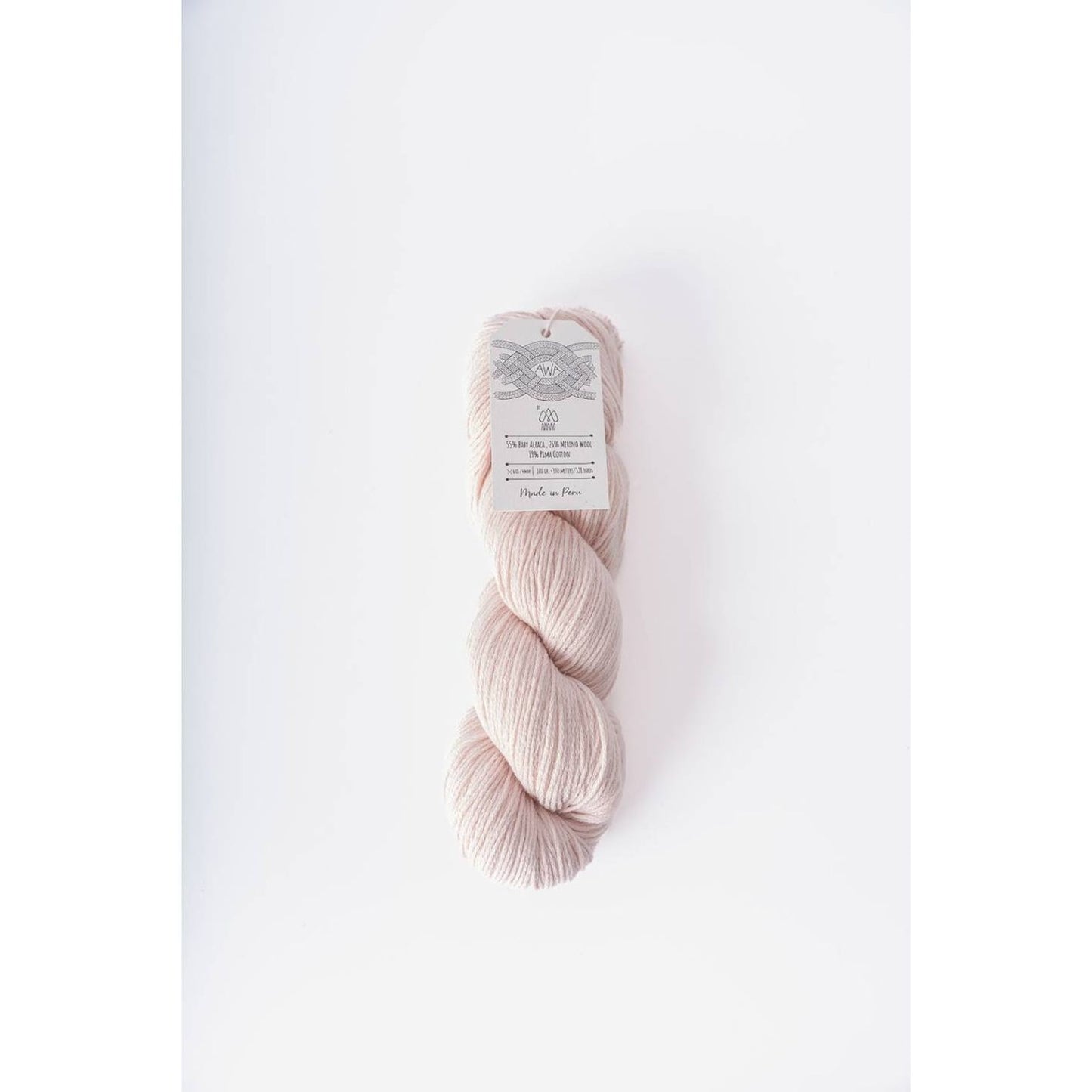 Berroco Amano yarn in a soft pastel pink hue perfect for knitting and crocheting projects