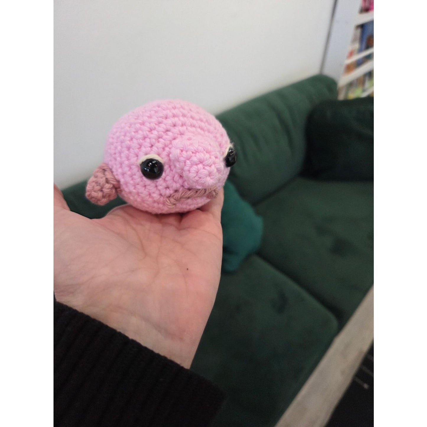 Handmade pink amigurumi creature from an amigurumi workshop near Chicago