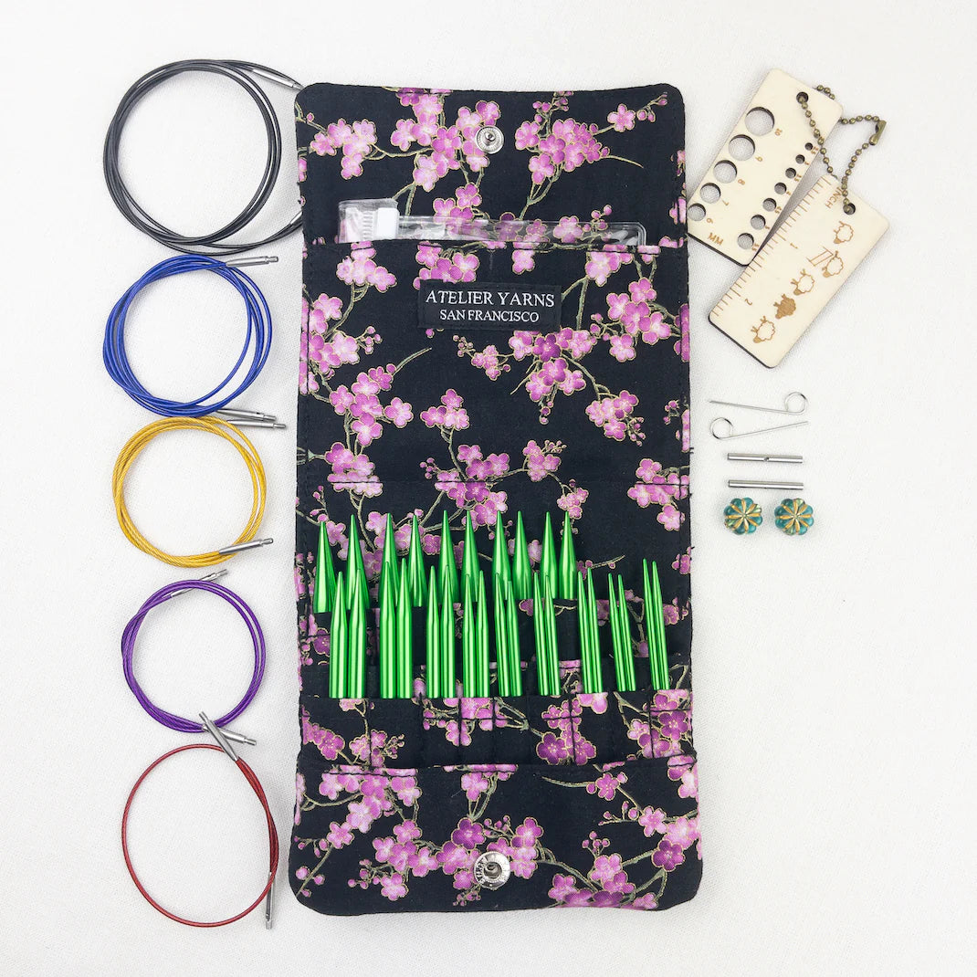 Atelier Yarns knitting needles interchangeable set with vibrant colors in a floral case