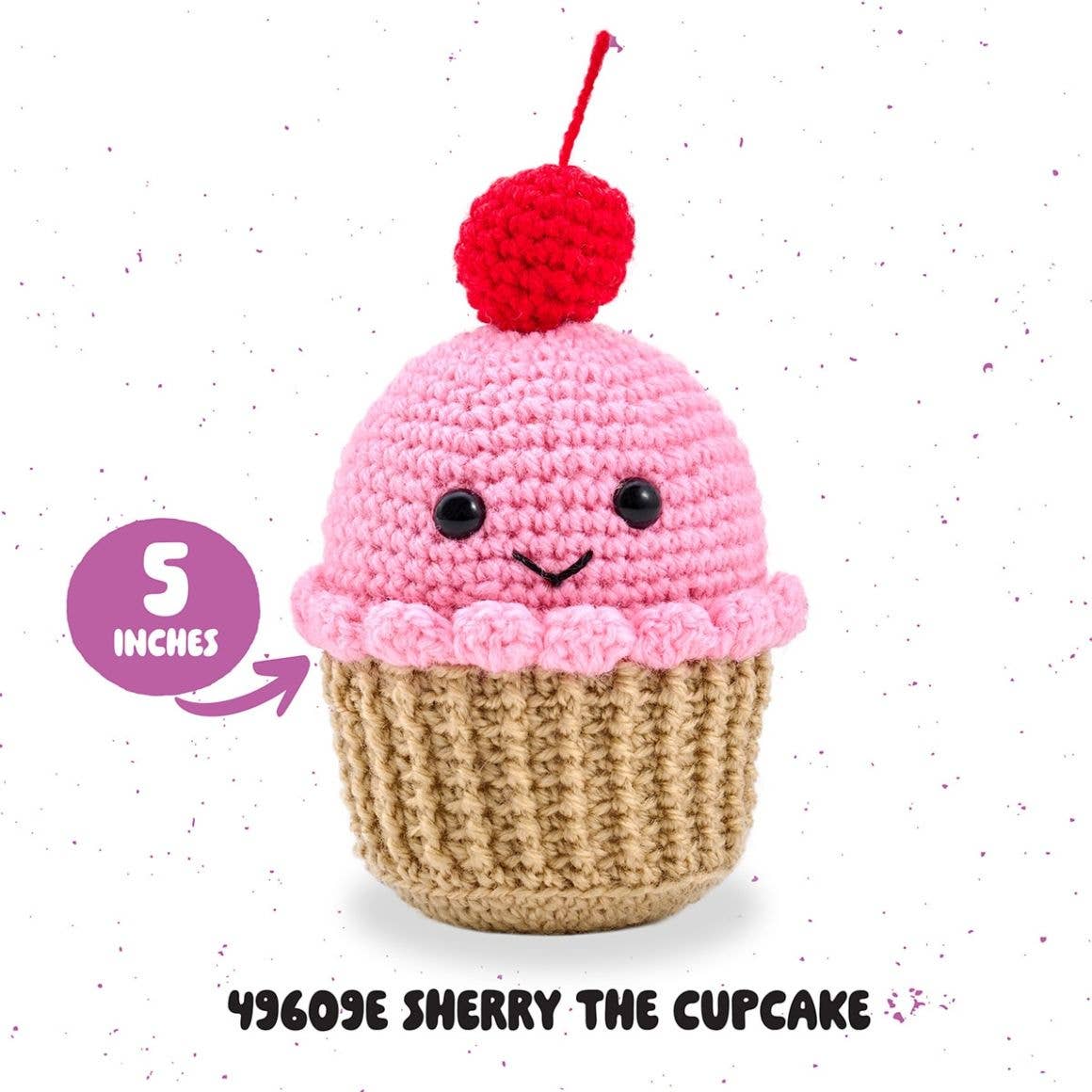 Plaid Crafts amigurumi crochet kit cupcake Sherry the Cupcake pink frosting with red cherry and smiling face 5 inches