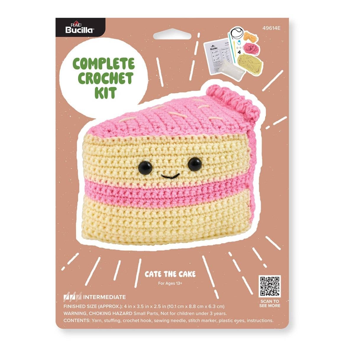 Plaid Crafts Cate the Cake crochet kit packaging showing pink yellow cake plush and materials beginner amigurumi crochet project