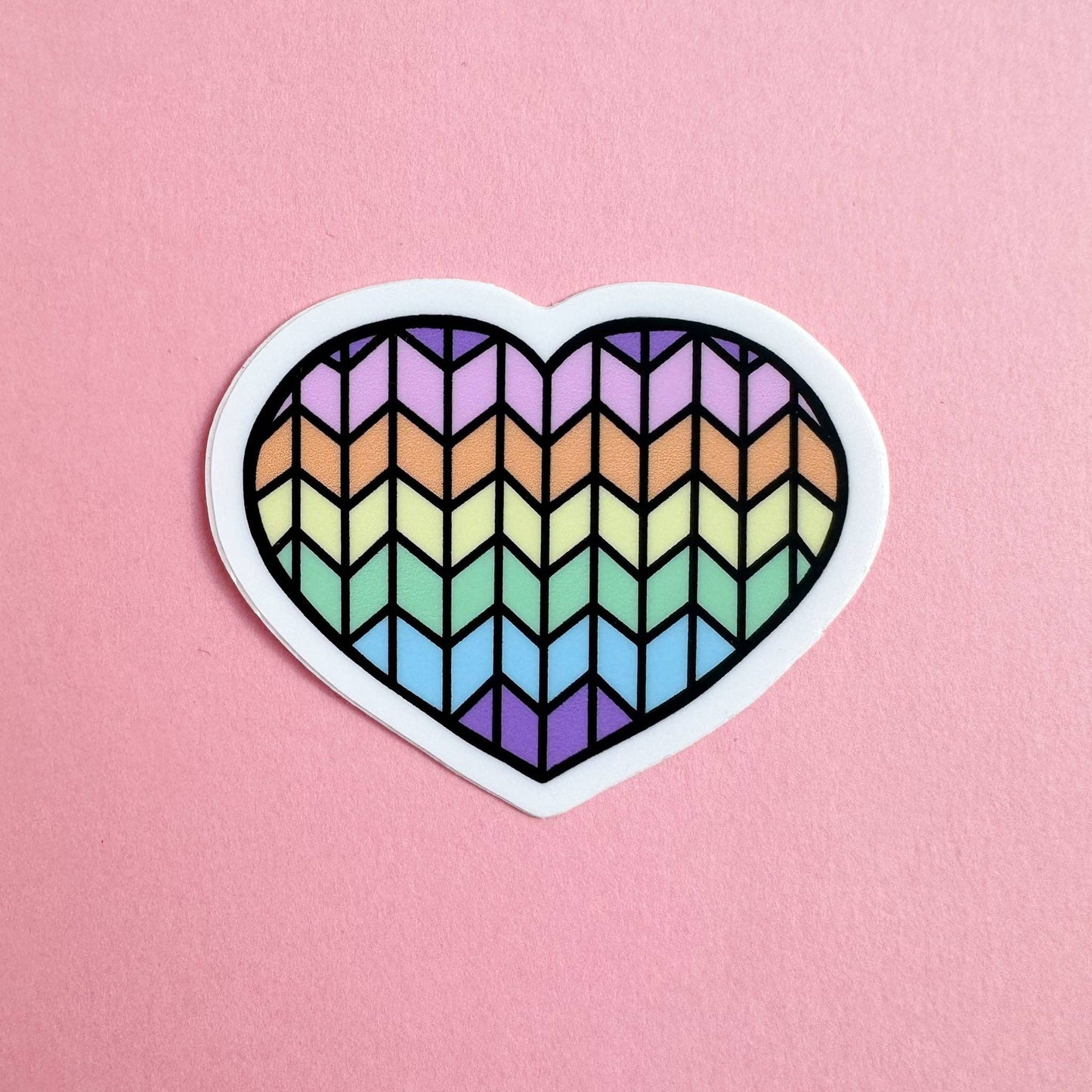 Colorful heart-shaped cat sticker with a geometric rainbow pattern for cat lovers