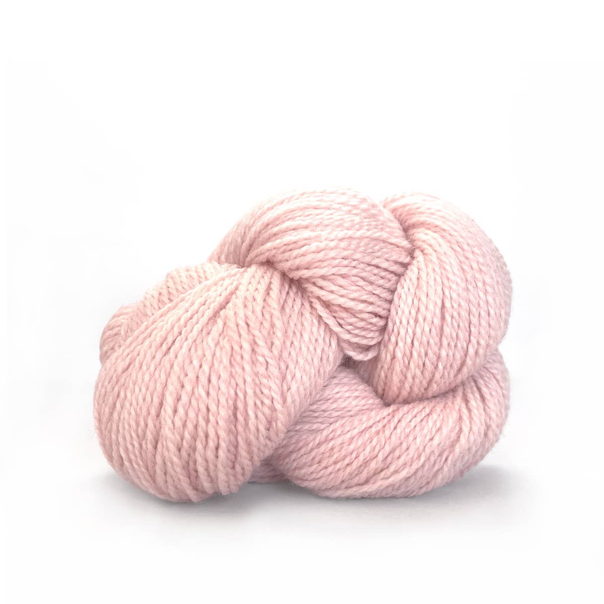 Kelbourne Woolens pale blush skein of fingering weight 100% wool yarn soft plied single skein for knitting