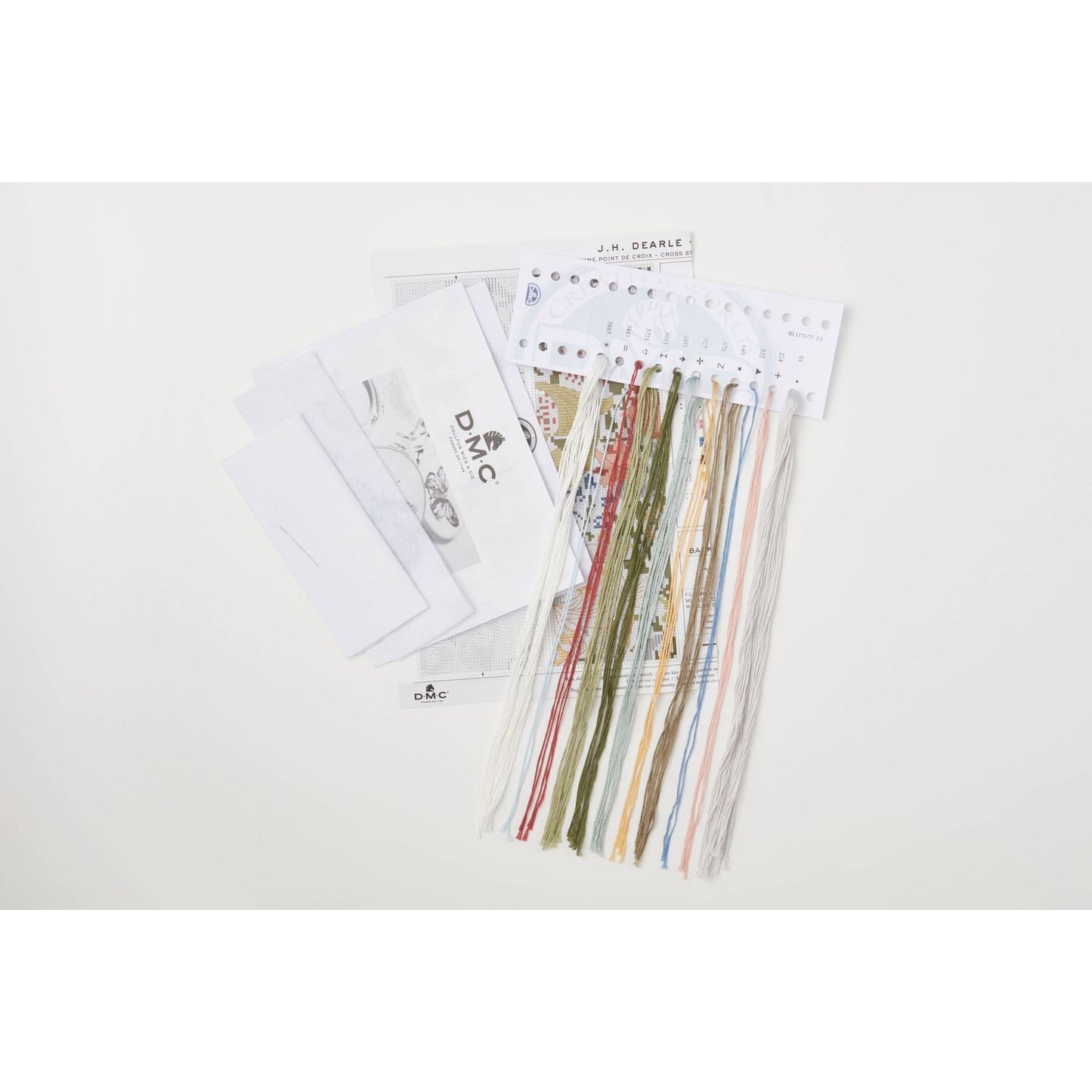 DMC cross stitch kit with colorful threads and pattern sheets for creative stitching projects