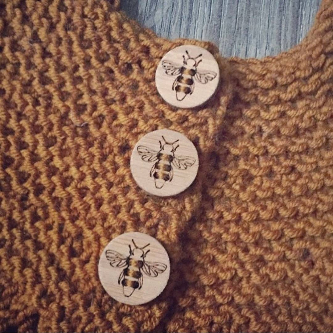 Katrinkles honey bee wooden buttons on a knitted mustard sweater detail