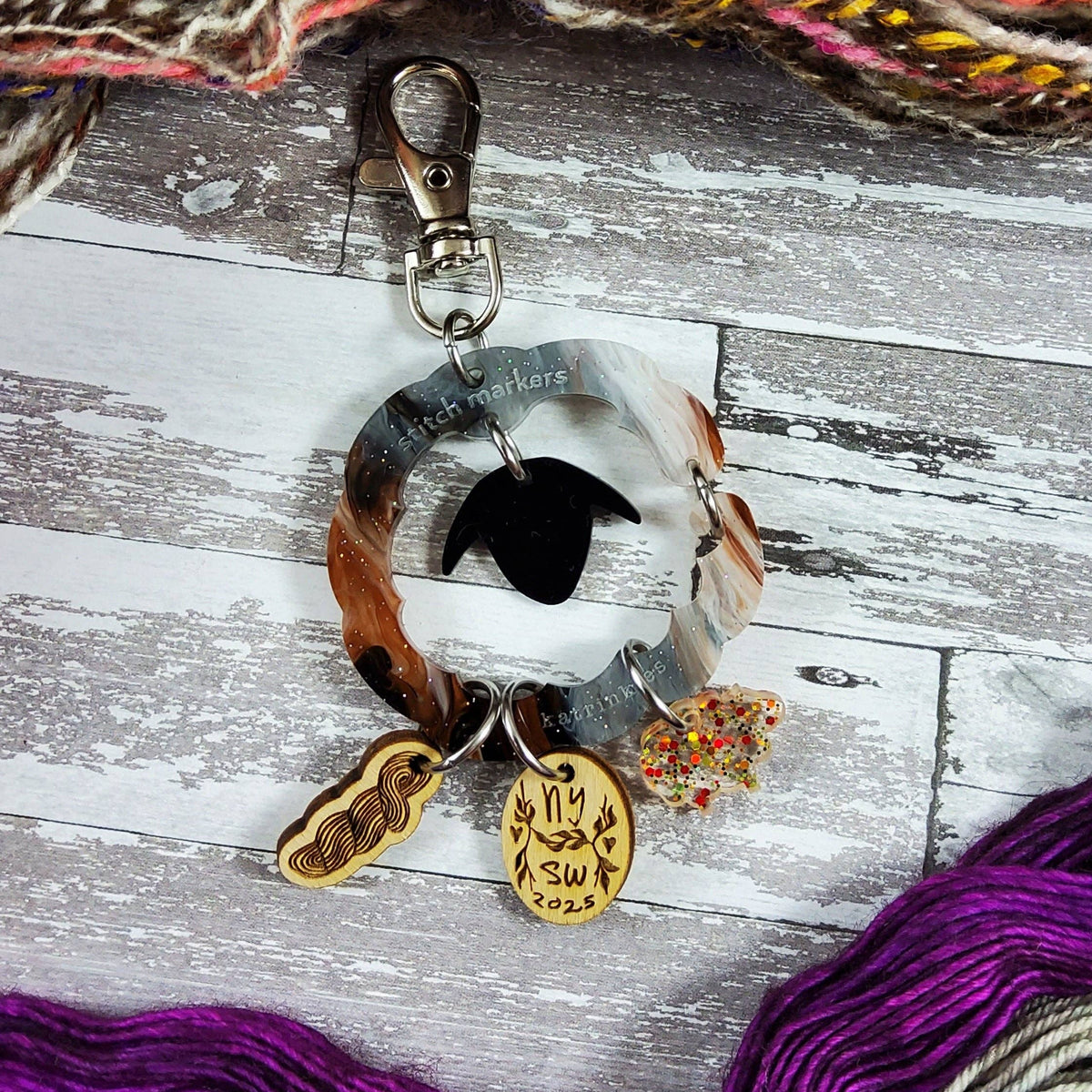 Katrinkles purse bag charm featuring a colorful design with various stitch markers and decorative elements