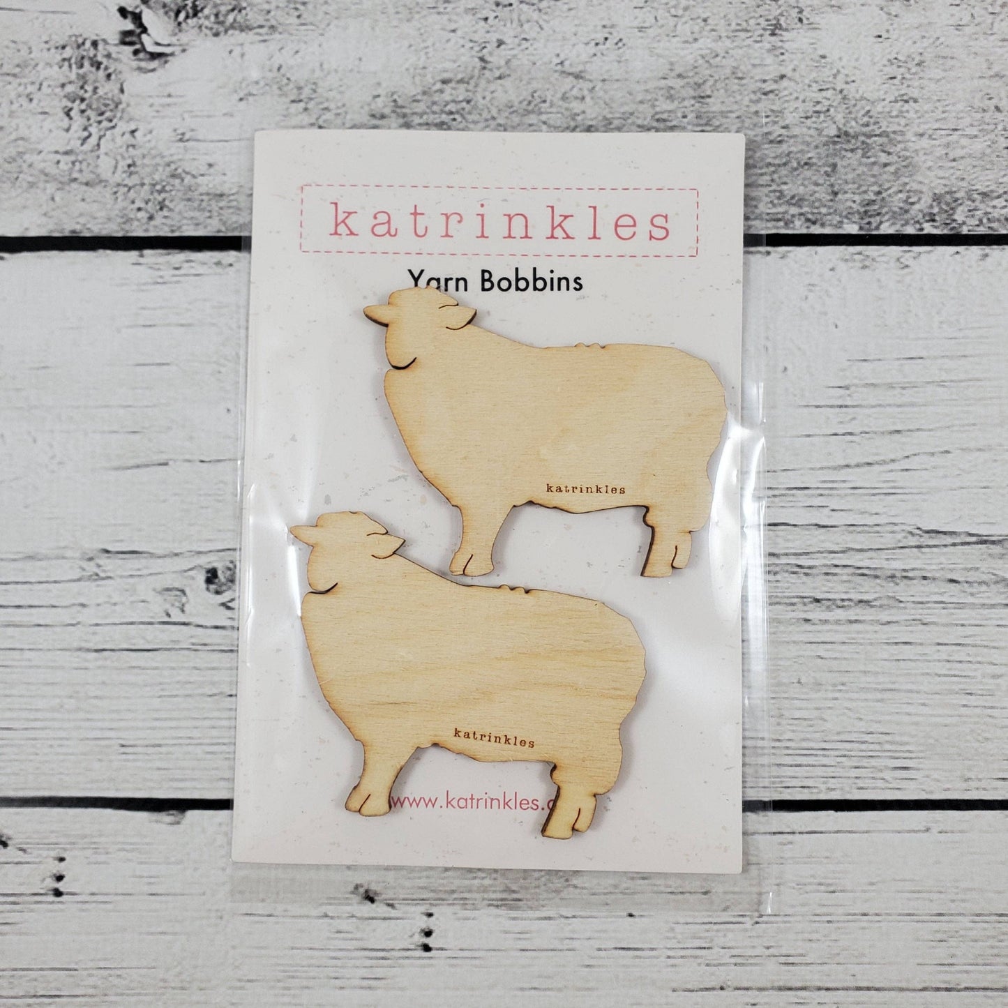 Katrinkles Vintage Wooden Bobbins featuring sheep designs for crafting and yarn storage