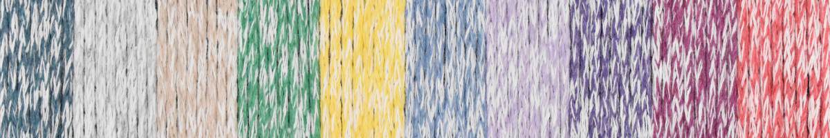 Colorful skeins of KFI Collection Eco Bag yarn by Knitting Fever in various vibrant shades