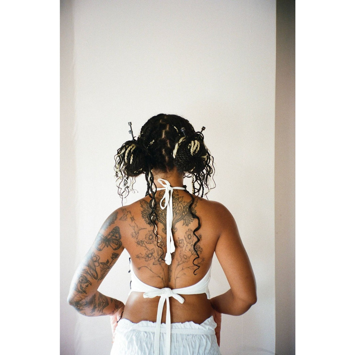 Hey Ricochet hair clip styled with braids resembling knitting needles for a trendy look