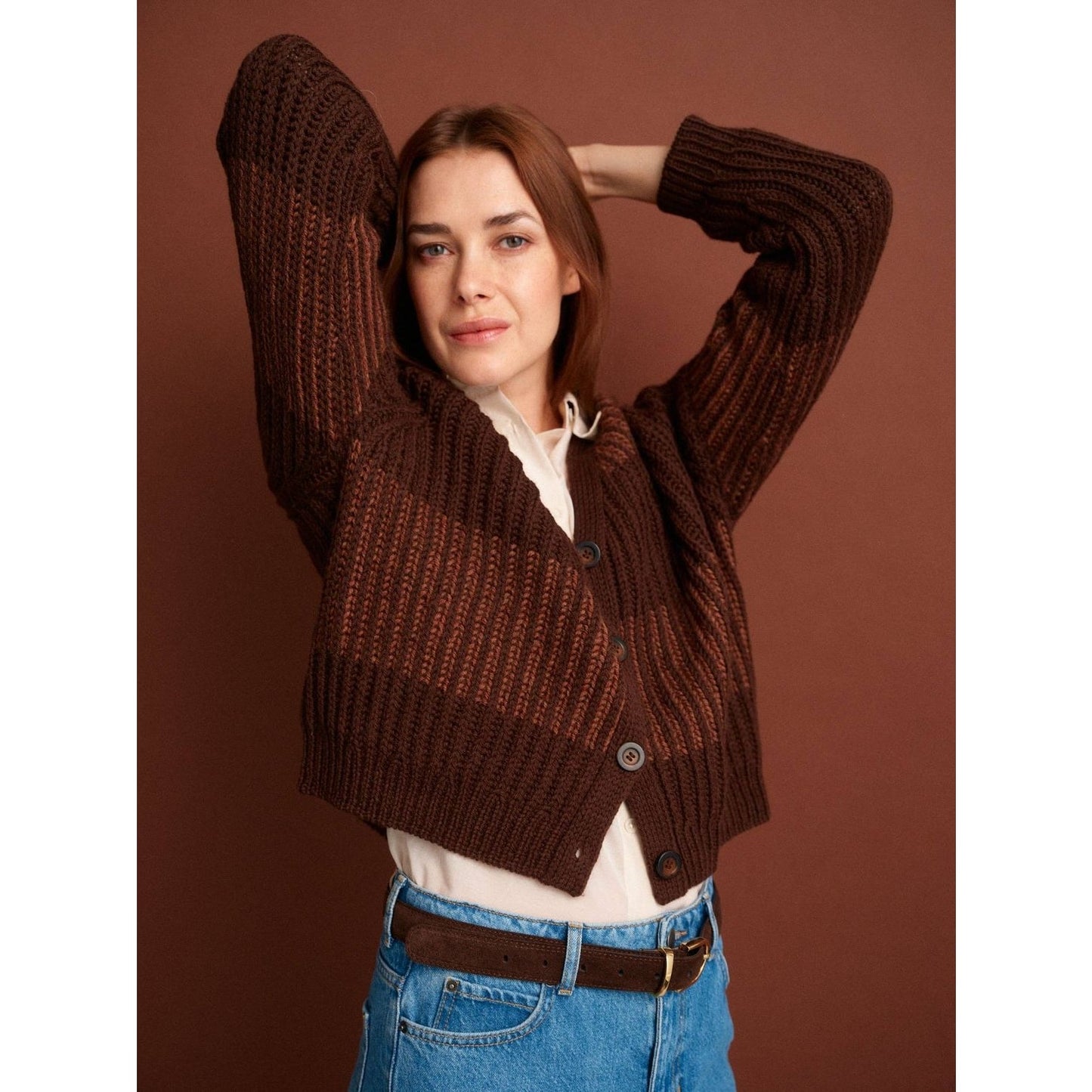 Stylish brown knitted cardigan featuring patterns in knitting, perfect for a cozy look