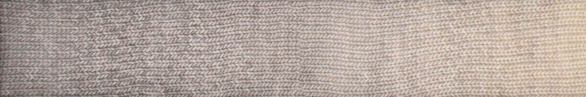Knitting Fever Laines du Nord luxury yarn in a soft neutral beige color wound in a skein
