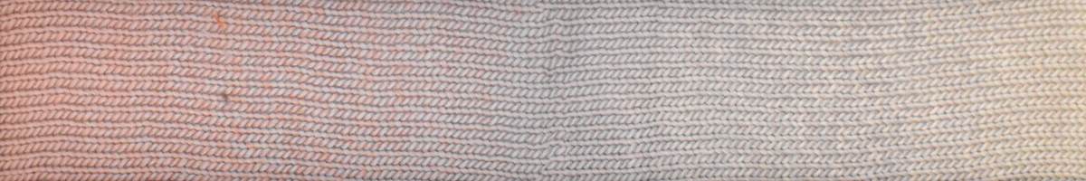 Close-up of Knitting Fever Laines du Nord luxury yarn in soft gradient shades for knitting projects