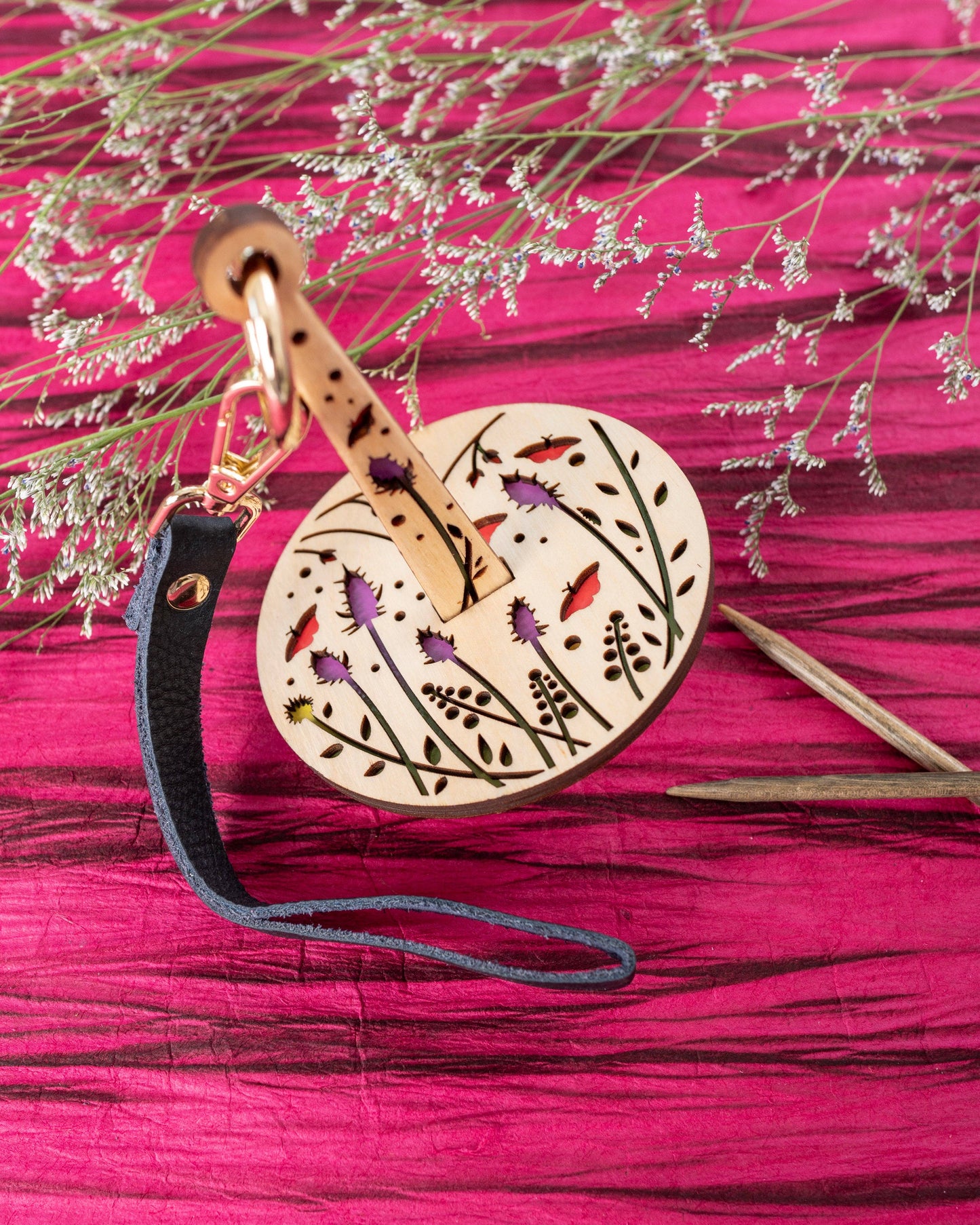 lemonwood knitting accessory wooden drop spindle with floral cutouts painted birds and leather strap