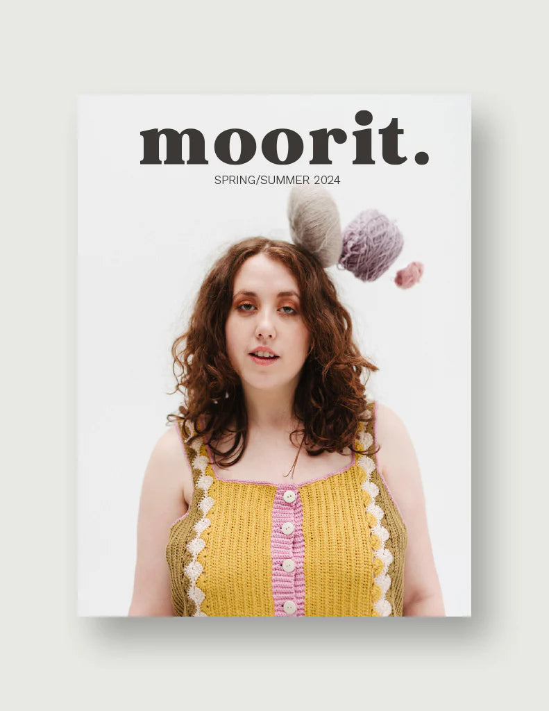 Moorit Magazine crochet patterns cover showing model in yellow crocheted tank top with yarn balls overhead