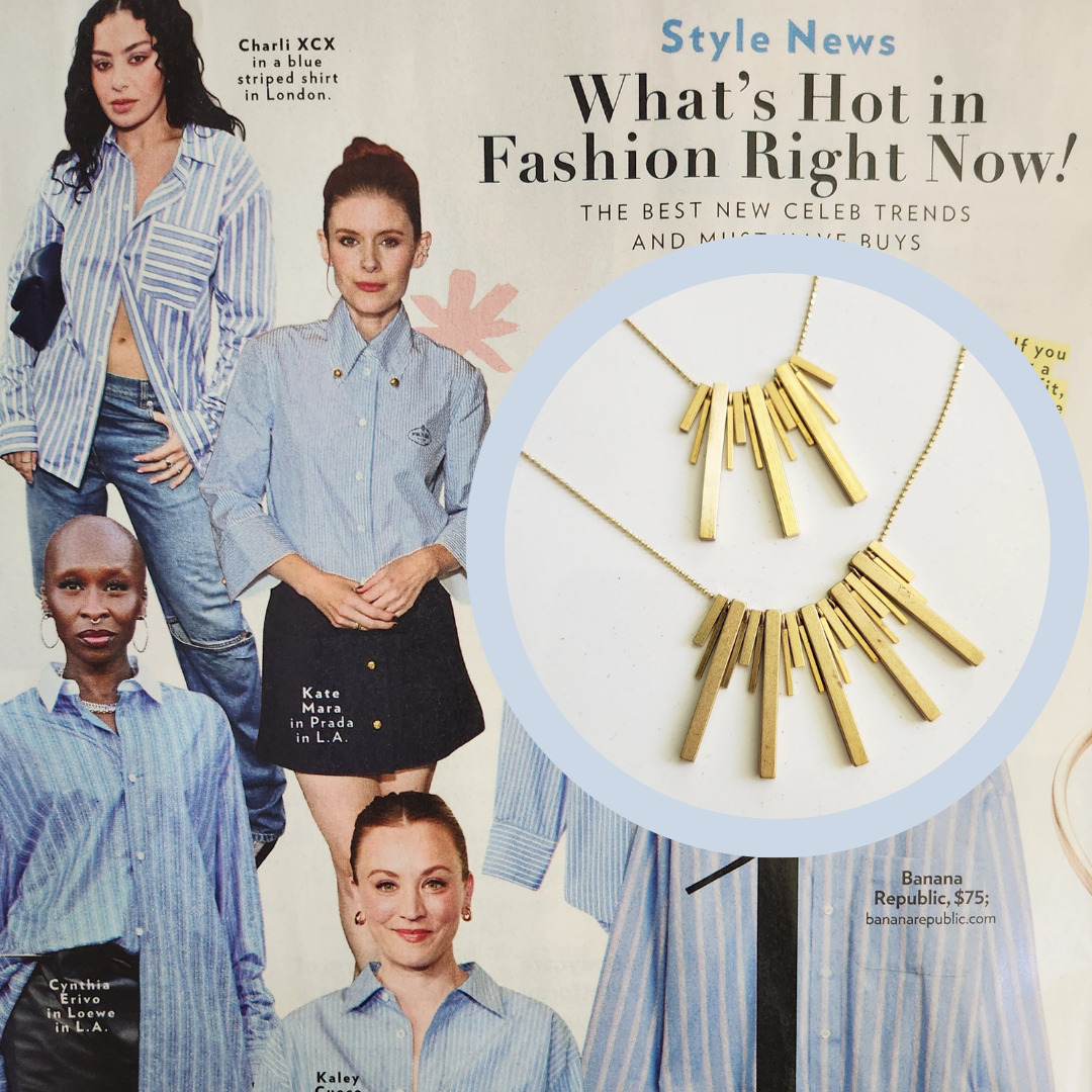 Sara Sela Jewelry gold bar cluster beaded edgy fashion necklace on chain against magazine fashion spread background