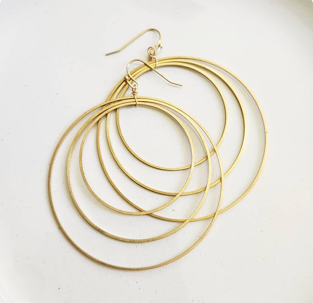 Sara Sela Jewelry brass circle hoop dangle earrings pair of layered thin concentric gold hoops with fishhook wires