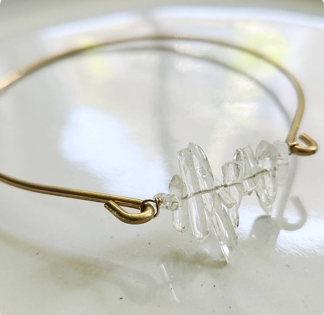 Sara Sela Jewelry gold wire clear quartz bangle bracelet with stacked raw quartz chip centerpiece and hook clasp