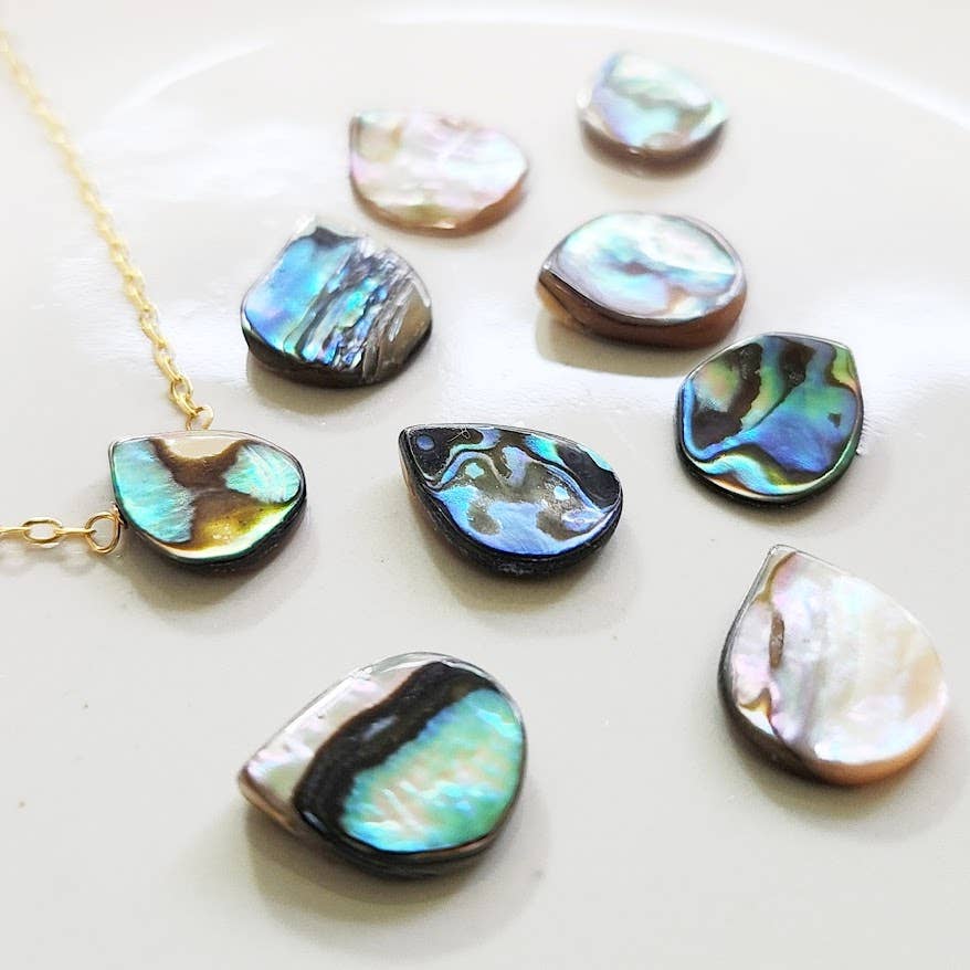 Sara Sela Jewelry rainbow abalone shell teardrop jewelry pendants showing iridescent blue green hues