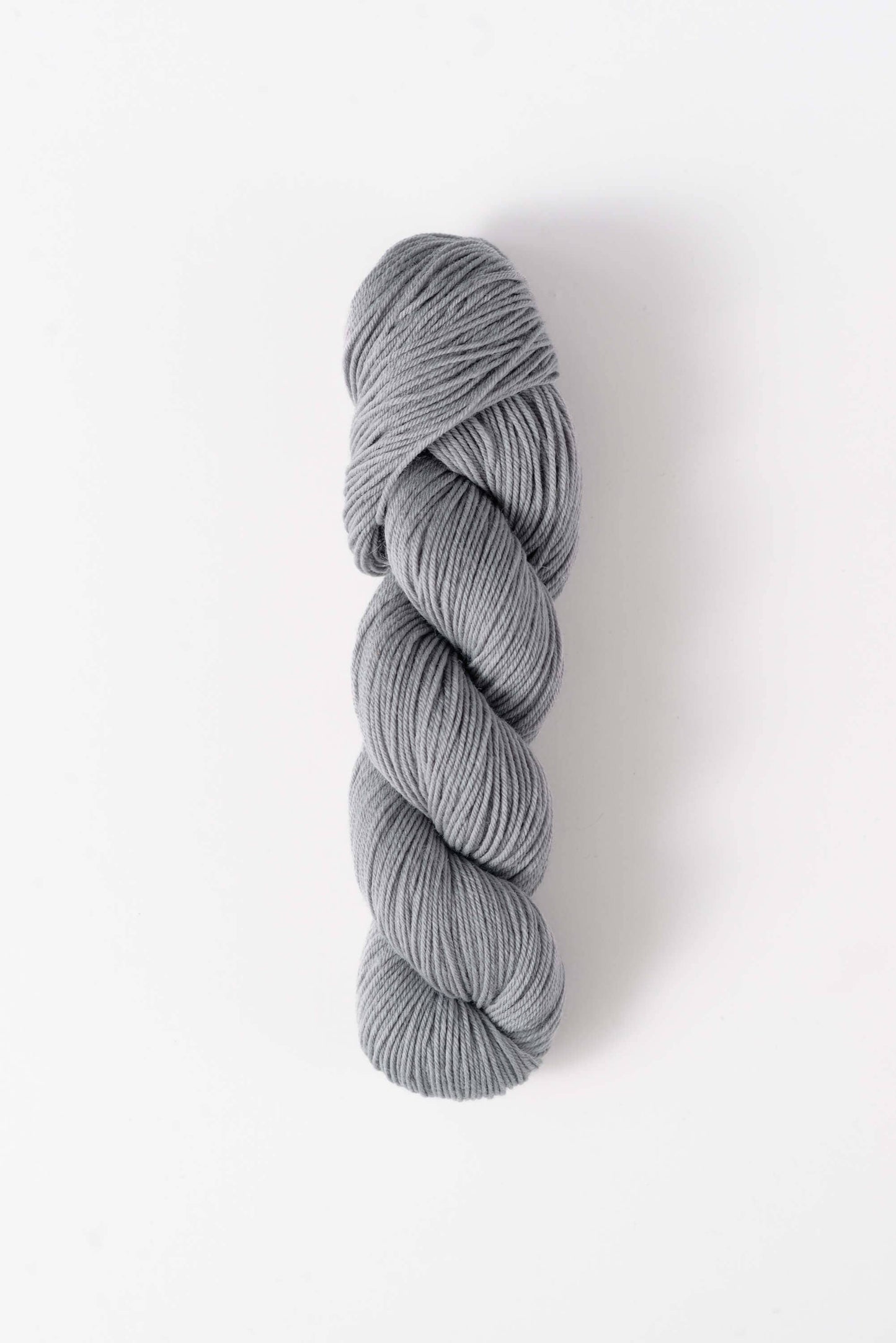 Quince & Co. light gray superwash merino fingering yarn skein for knitting and crocheting