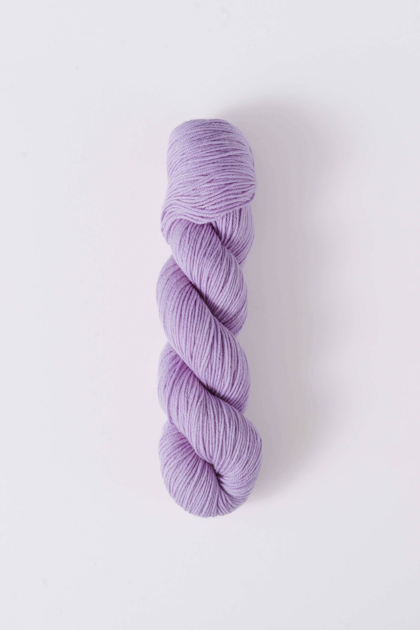 Quince & Co. superwash merino fingering yarn in soft lavender color skein