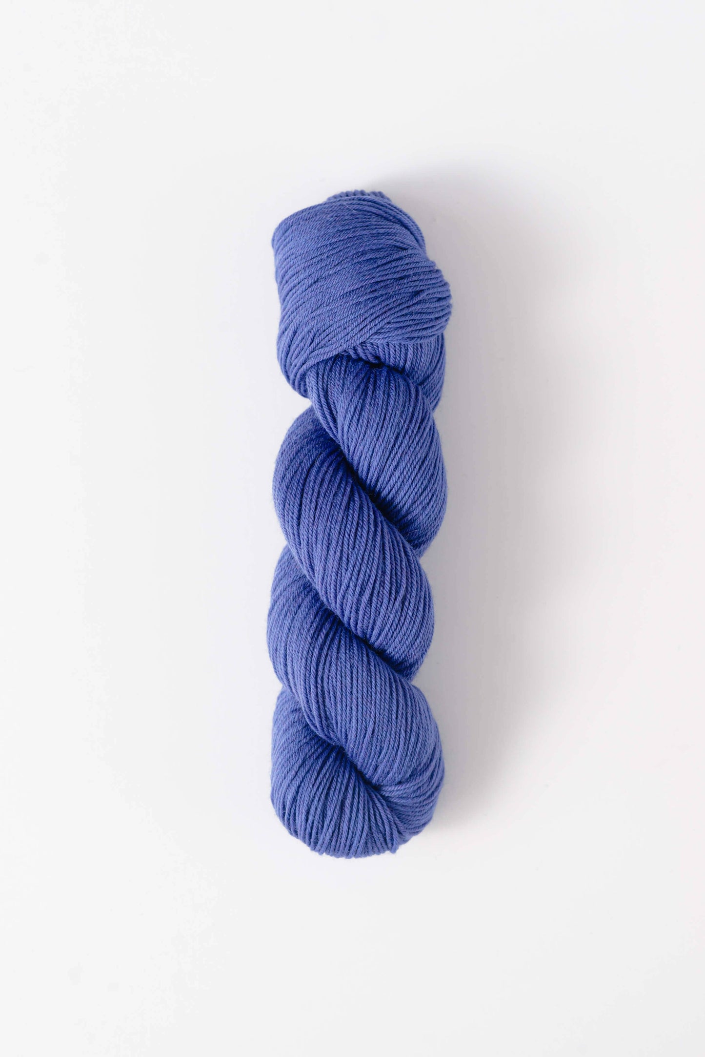 Quince and Co superwash merino fingering yarn in a soft blue color for knitting and crochet