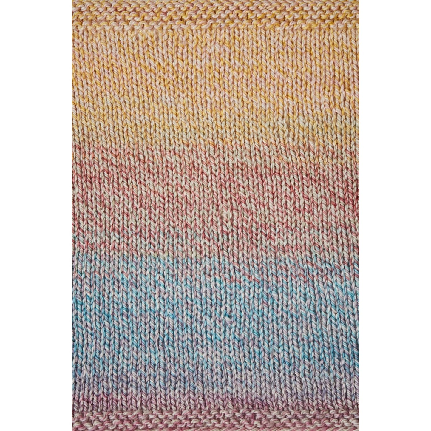 Urth Yarns Spiral Grain Light Worsted in soft gradient colors perfect for creating stunning knitwear