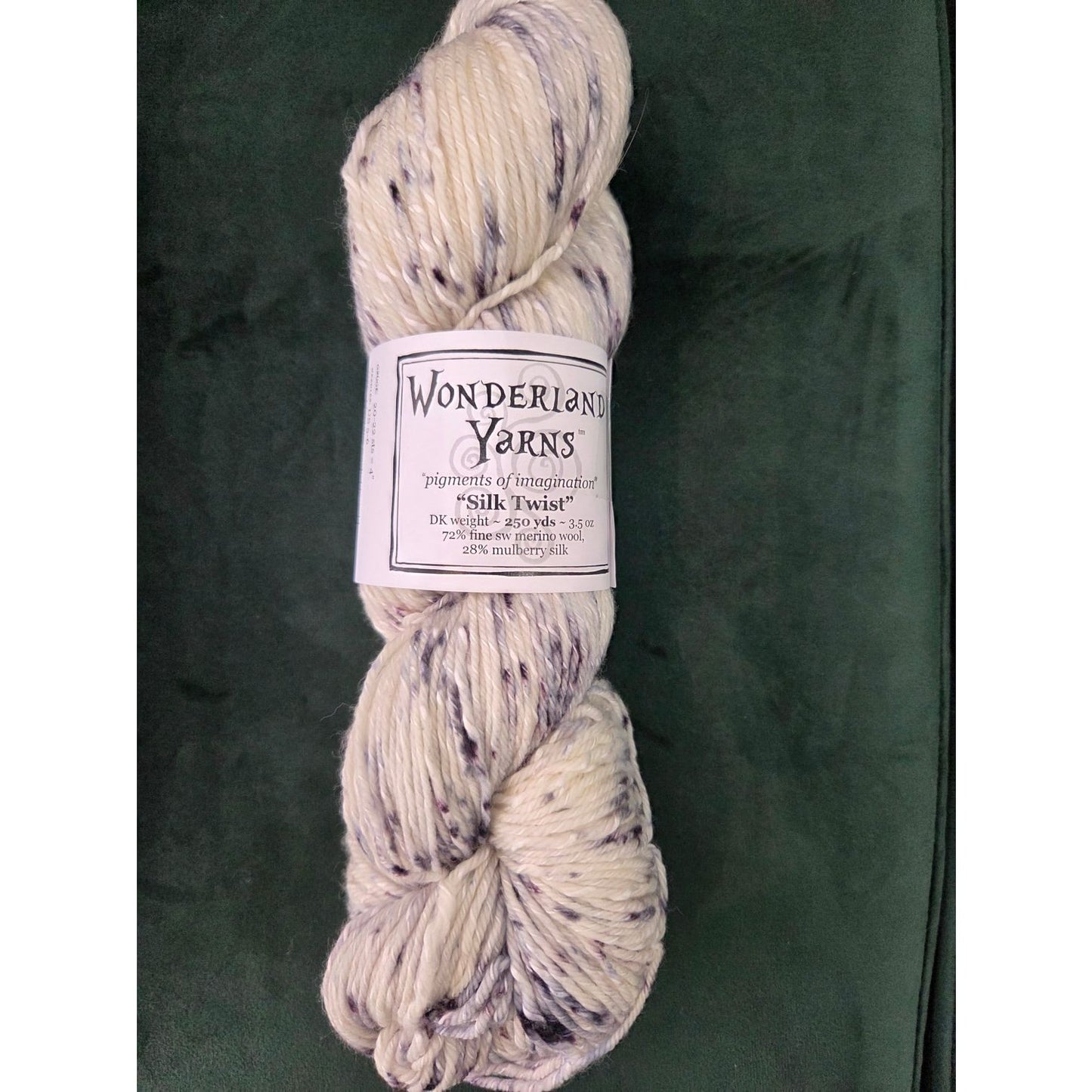 Frabjous Fibers hand dyed speckled cream and lavender skein of Wonderland Yarns Silk Twist