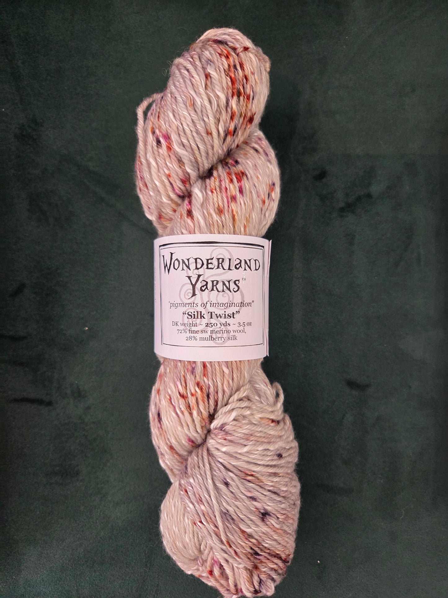 Frabjous Fibers skein of Wonderland Yarns Silk Twist hand dyed speckled cream pink silk blend yarn