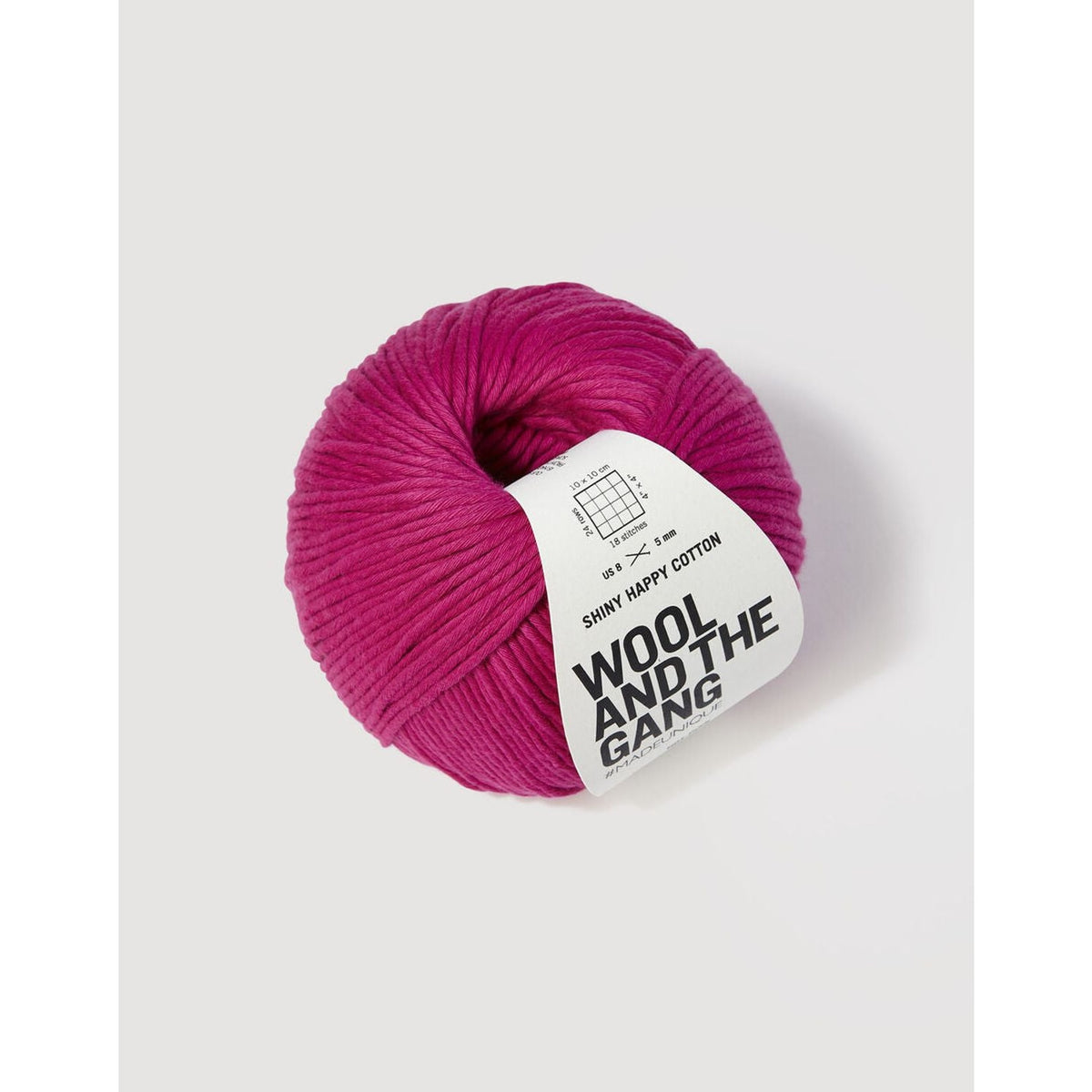 Berroco shiny happy cotton yarn in bright pink, perfect for knitting and crochet projects