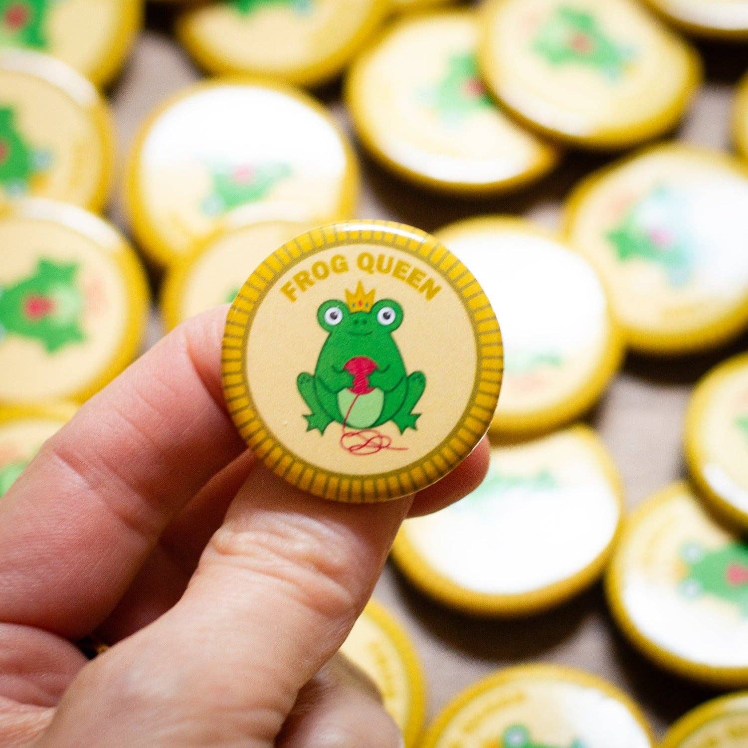 Camp Stitchwood Frog Queen Enamel Pin featuring a frog for knitting knits enthusiasts