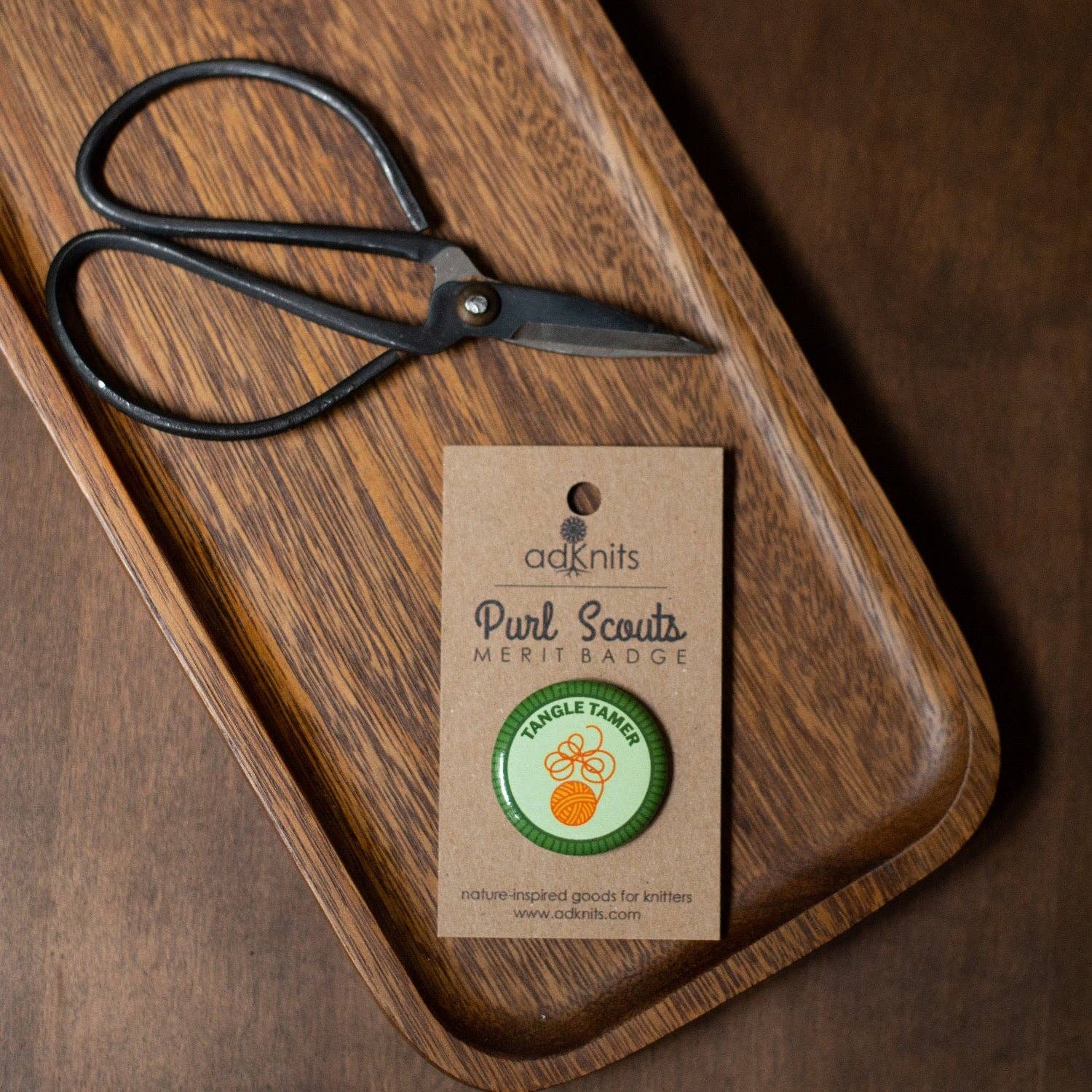 Camp Stitchwood Purl Scouts Merit Badge and Scissors on Wooden Tray for knitting knits enthusiasts