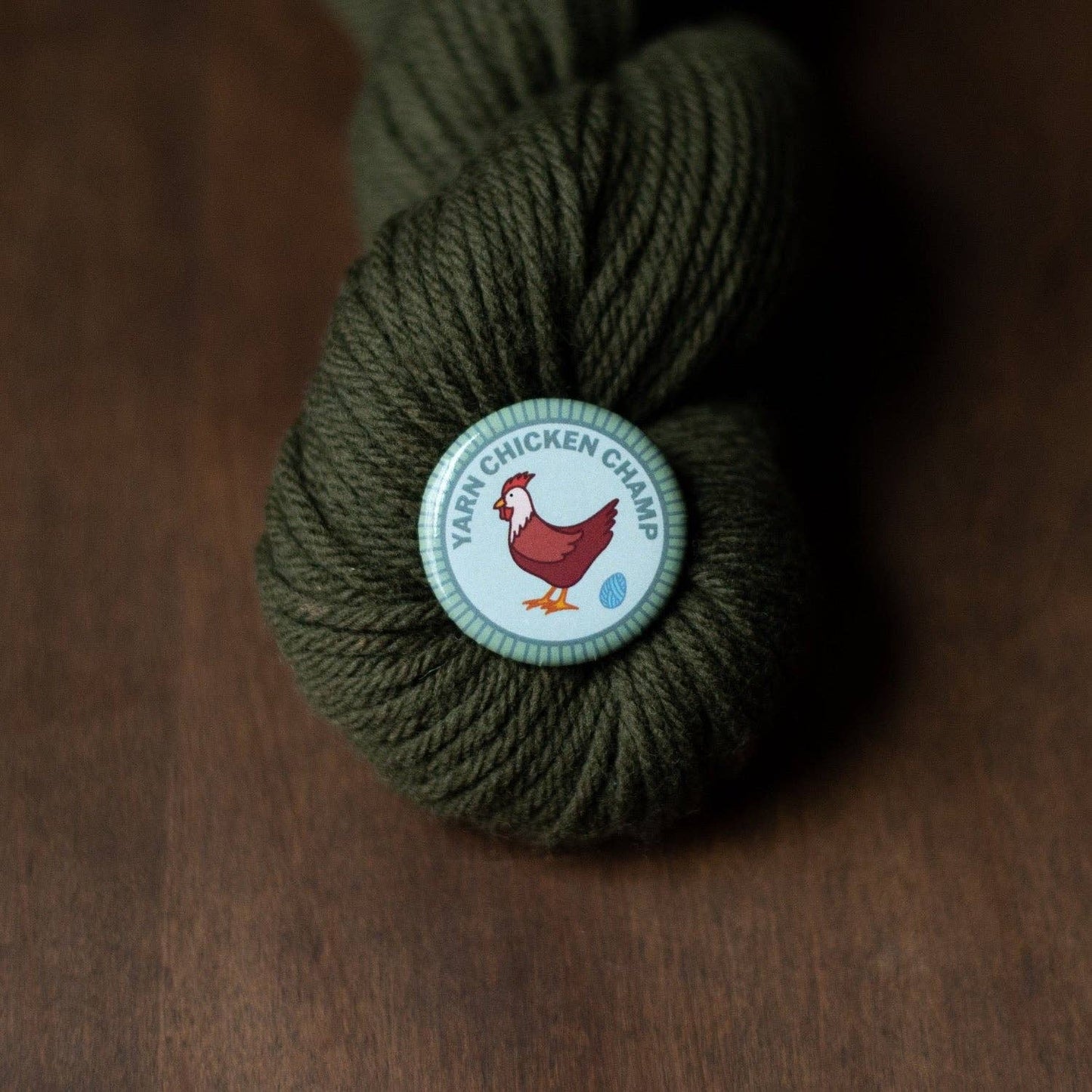 Camp Stitchwood Yarn Chicken Champ in Olive Green, perfect for yarn retailers near me