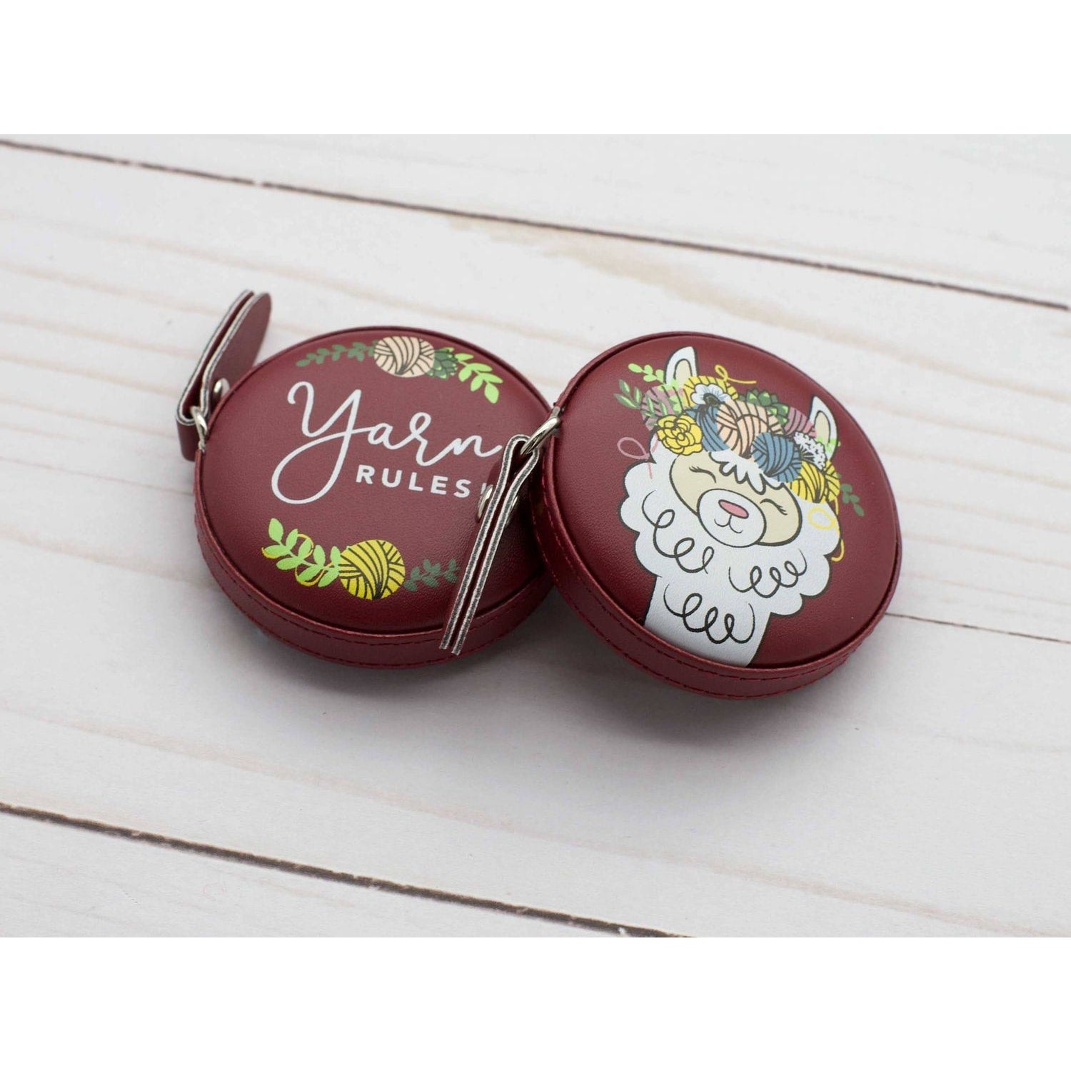 Decorative yarn case featuring alpaca species design with floral accents and the text Yarn Rules