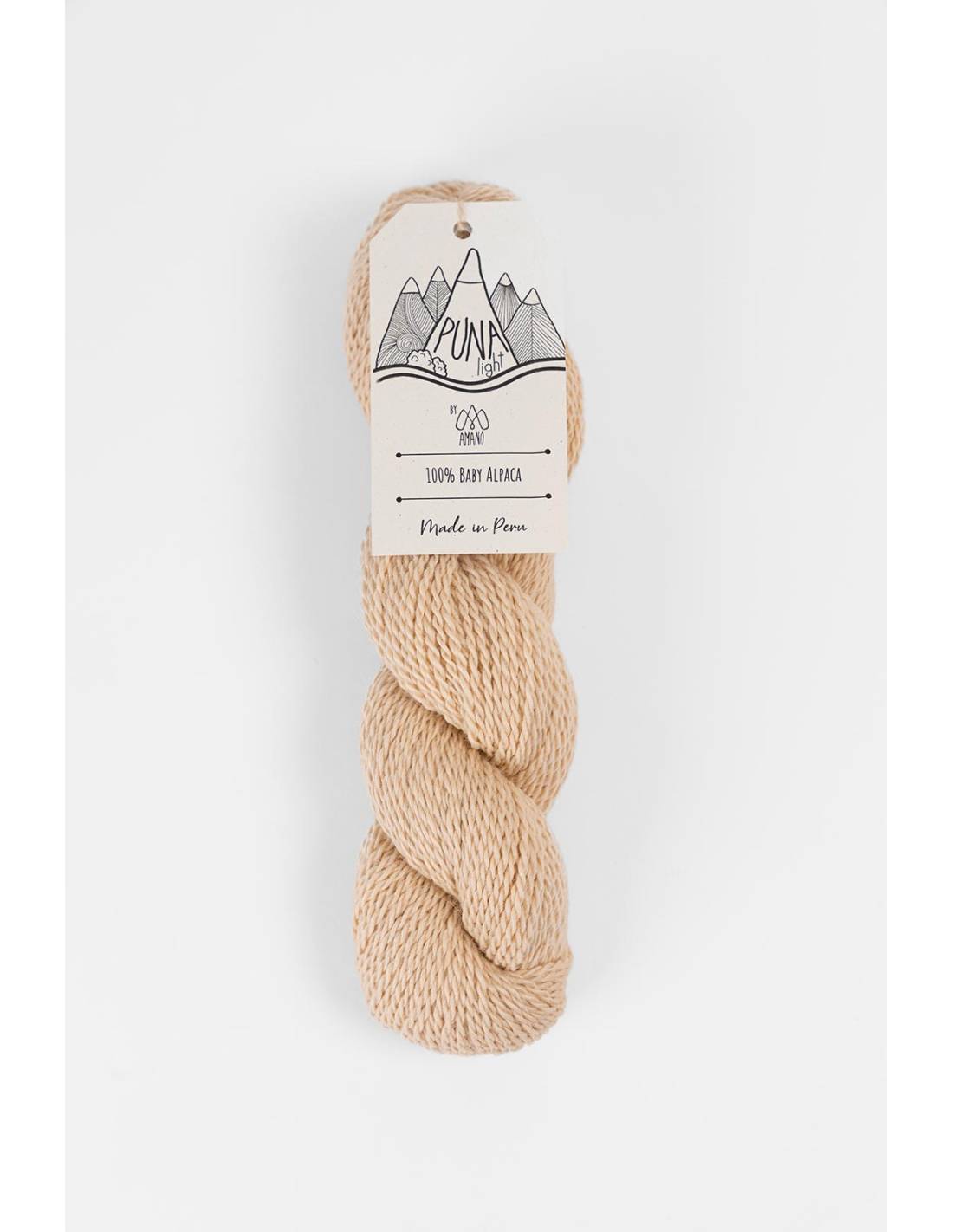 Amano Puna Light baby alpaca yarn skein in natural beige with Berroco tag for soft lightweight knitting projects