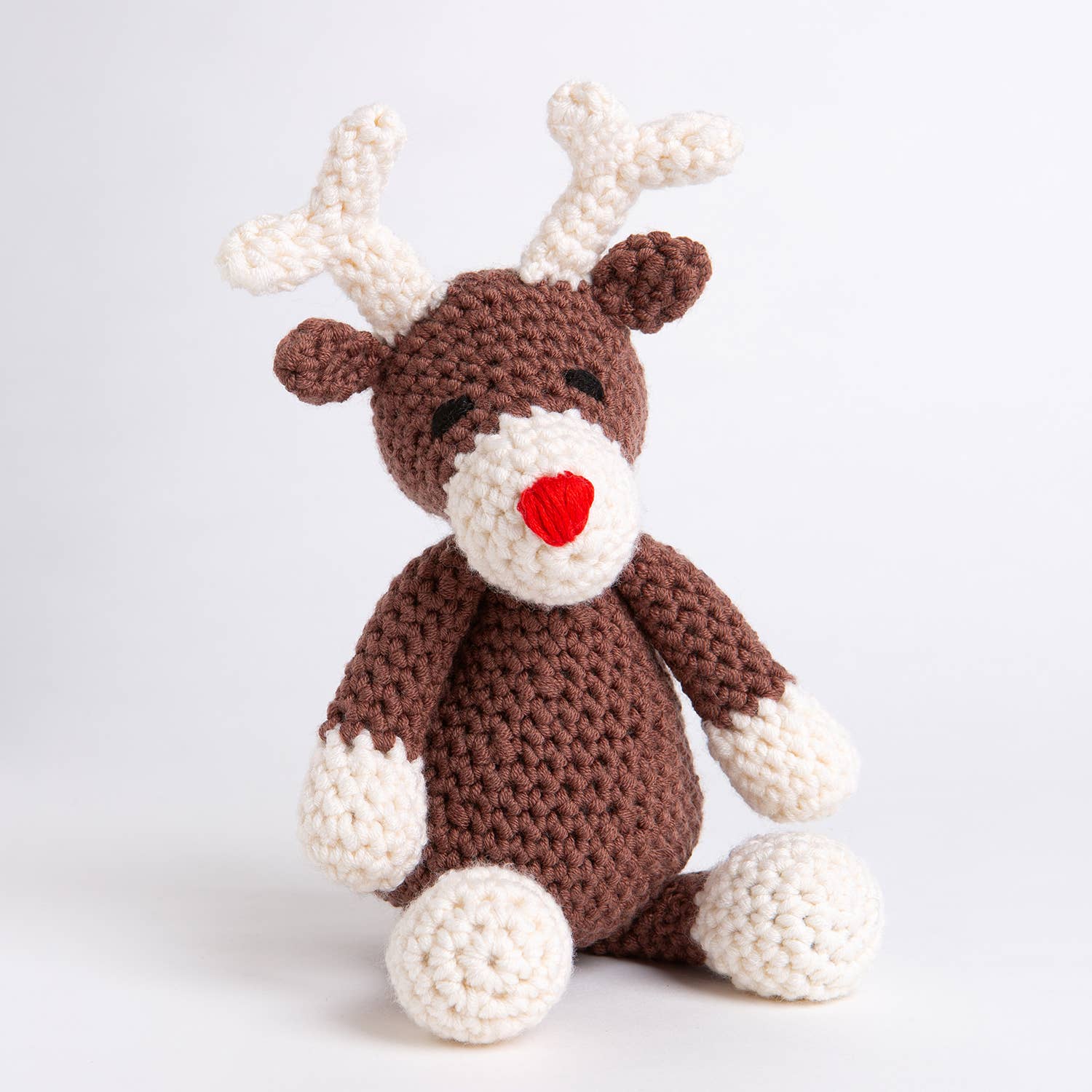 Belle the Reindeer crochet pattern by Wool Couture Company brown and cream amigurumi reindeer with red nose