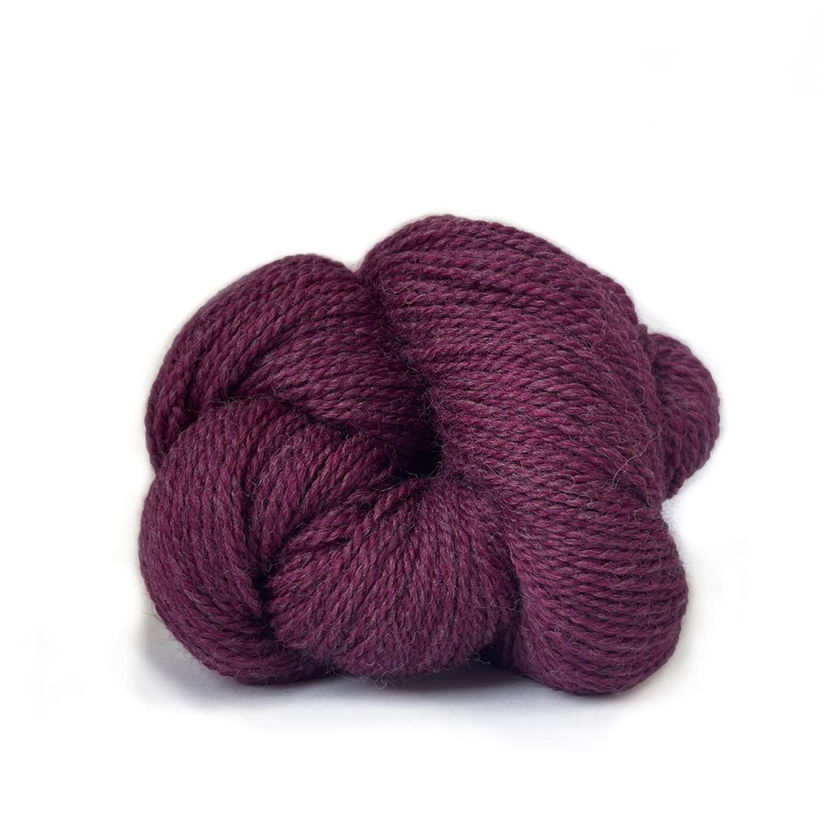 Kelbourne Woolens deep plum skein of fingering weight 100% wool yarn twisted plied on white background