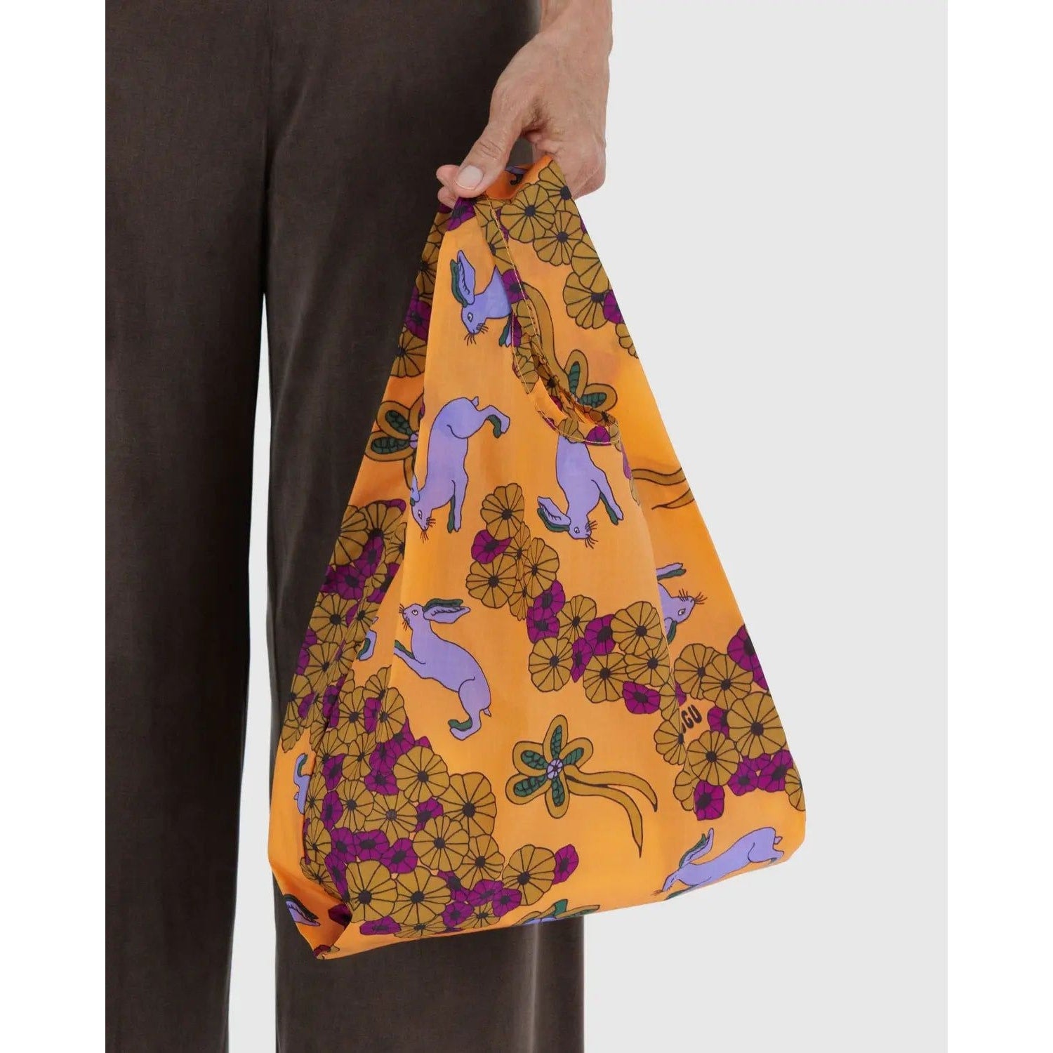 Baby Baggu reusable bag in vibrant orange with playful bunny and floral pattern, ideal for shopping