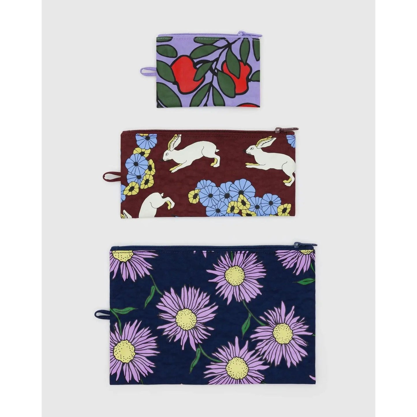 Baggu flat pouch set featuring three colorful pouches with floral and animal designs for versatile storage