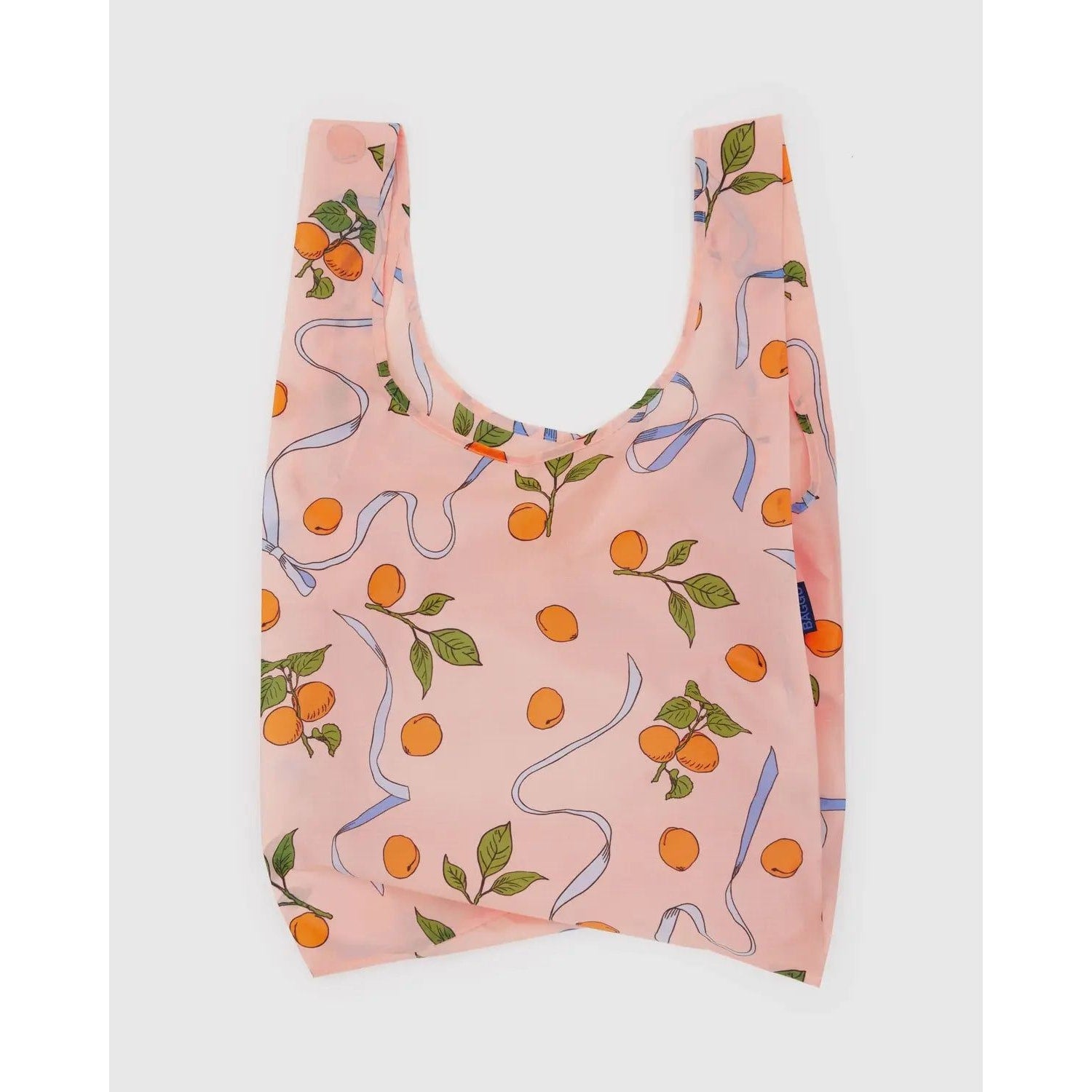 Baggu standard reusable bag in peach with orange and ribbon print for eco-friendly shopping