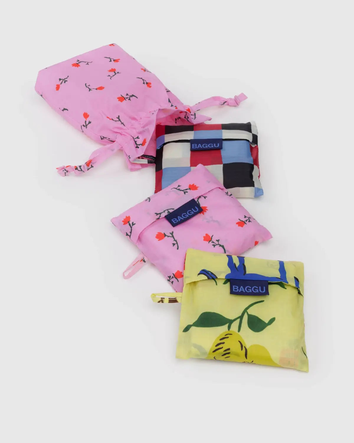 Baggu Standard Reusable Bag Set in assorted colors and patterns, includes a compact carrying pouch