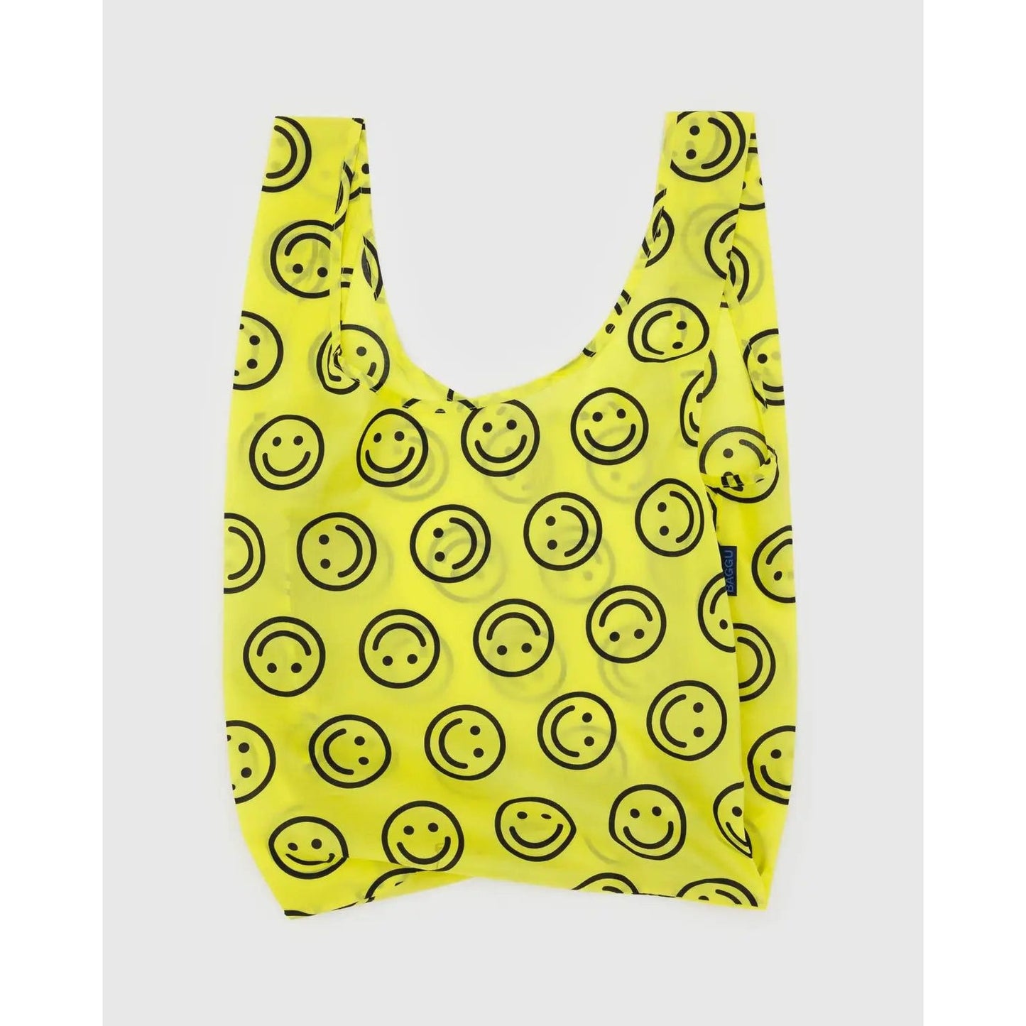 Bright yellow Baggu standard reusable bag with smiling face pattern for eco-friendly shopping