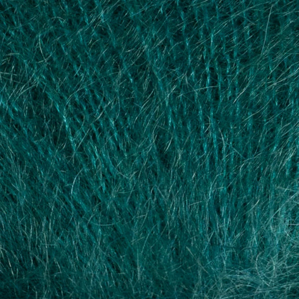 Soft teal Berroco yarn in a textured weave, perfect for knitting and crochet projects