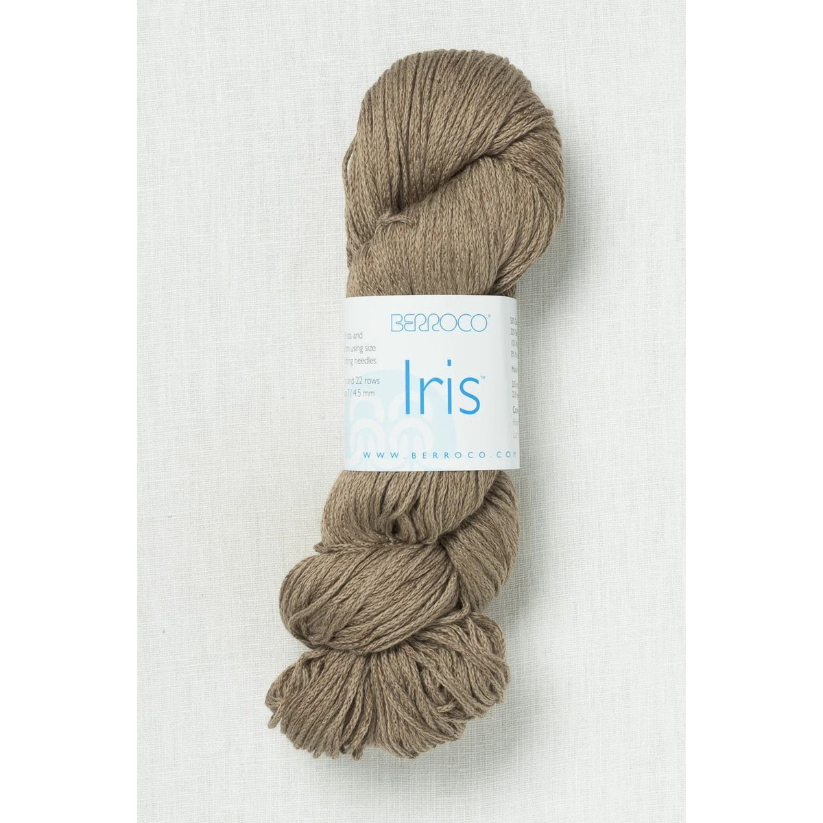 Skein of Berroco yarn in light brown, perfect for knitting and crochet projects.