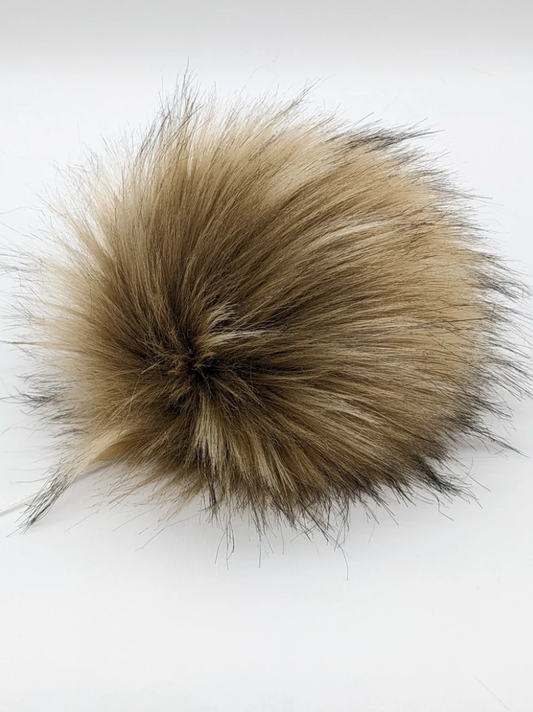 Blonde faux fur pom pom accessory perfect for adding a stylish touch to hats or bags