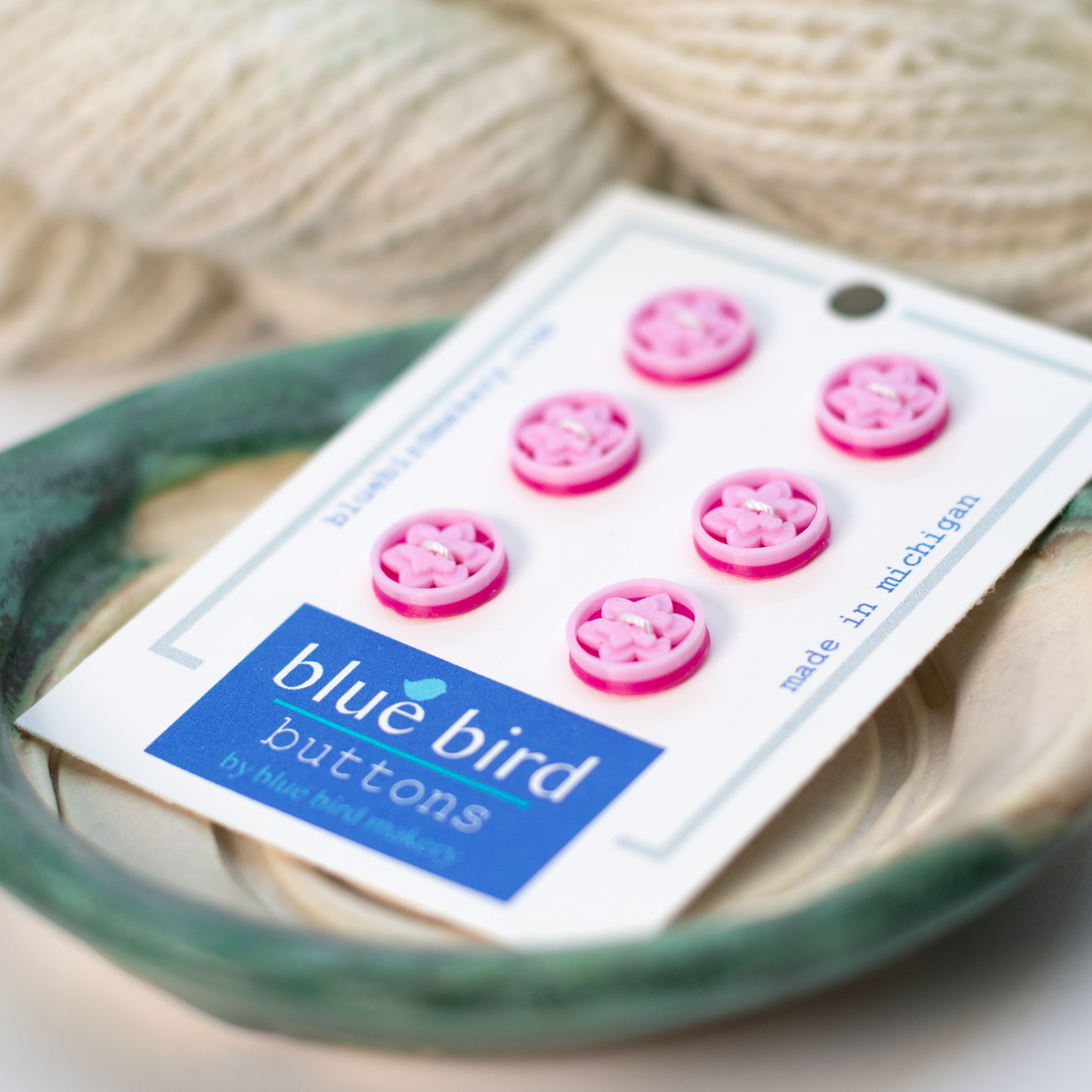 Pack of 12mm lotus buttons for knitting in pink color from Blue Bird Makery