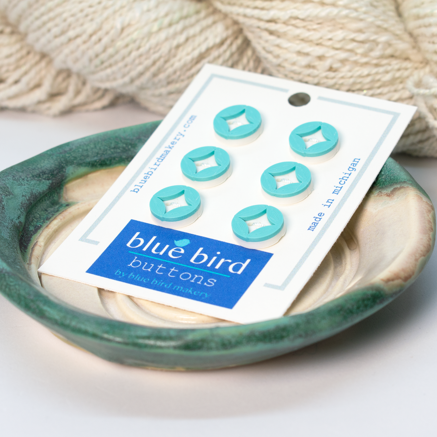 Set of six turquoise blue buttons on a card from Blue Bird Makery craft supplies for creative projects