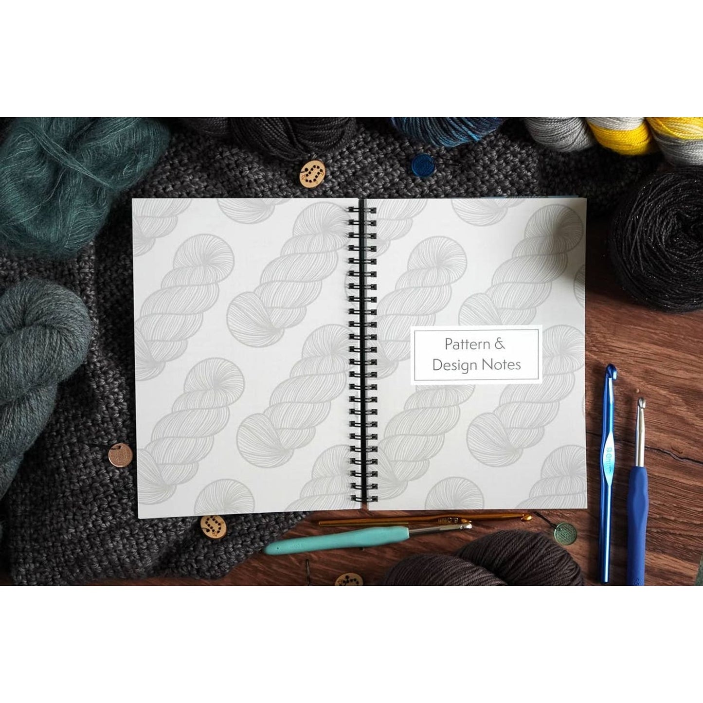 Spiral notebook titled Pattern and Design Notes surrounded by yarn crochet hooks and buttons crochet pattern organizer noteb…