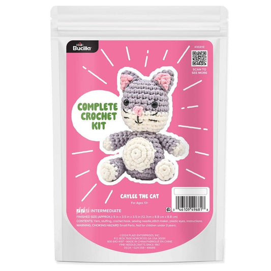 Bucilla Caylee the Cat crochet kit packaging showing finished gray and white crocheted cat plush on pink background