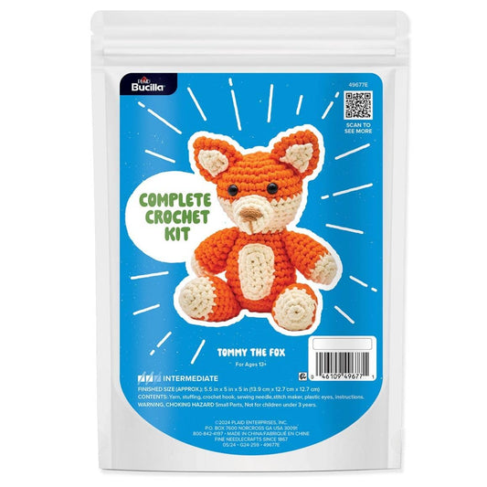 Bucilla Tommy the Fox kit complete crochet kit packaging showing orange crocheted fox plush on blue