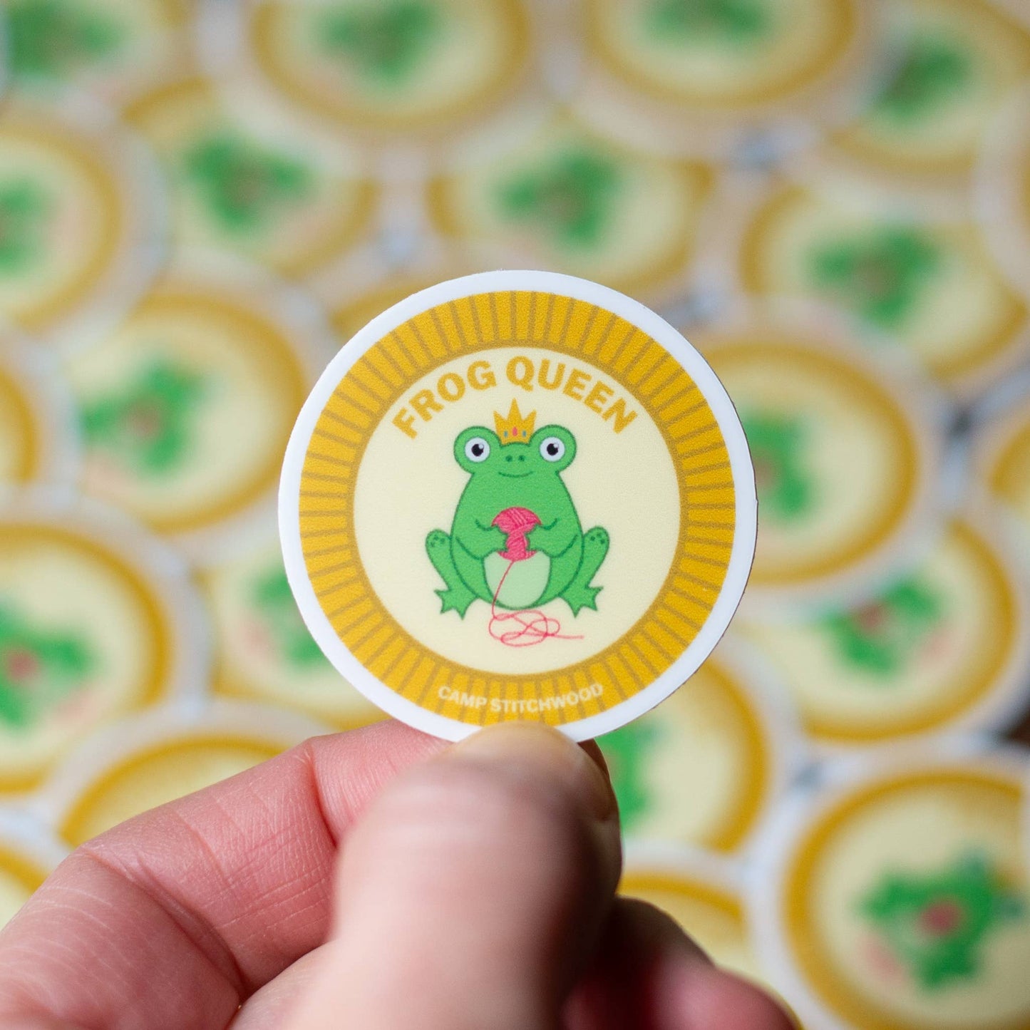 Colorful Camp Stitchwood name badge sticker featuring a Frog Queen design for fun identification